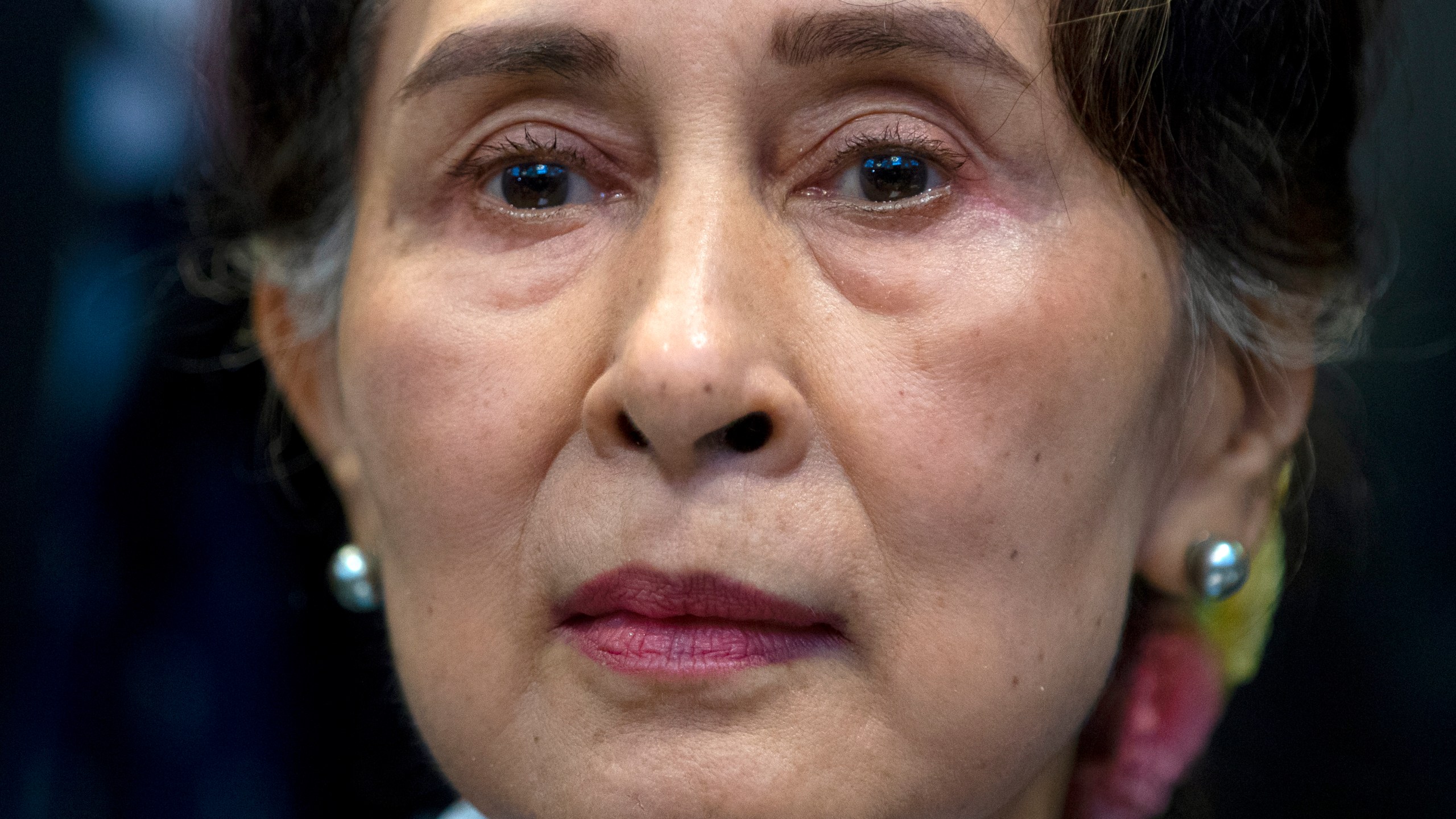 FILE - Myanmar's then eader Aung San Suu Kyi waits to address judges of the International Court of Justice on the second day of three days of hearings in The Hague, Netherlands, Dec. 11, 2019. (AP Photo/Peter Dejong, File)