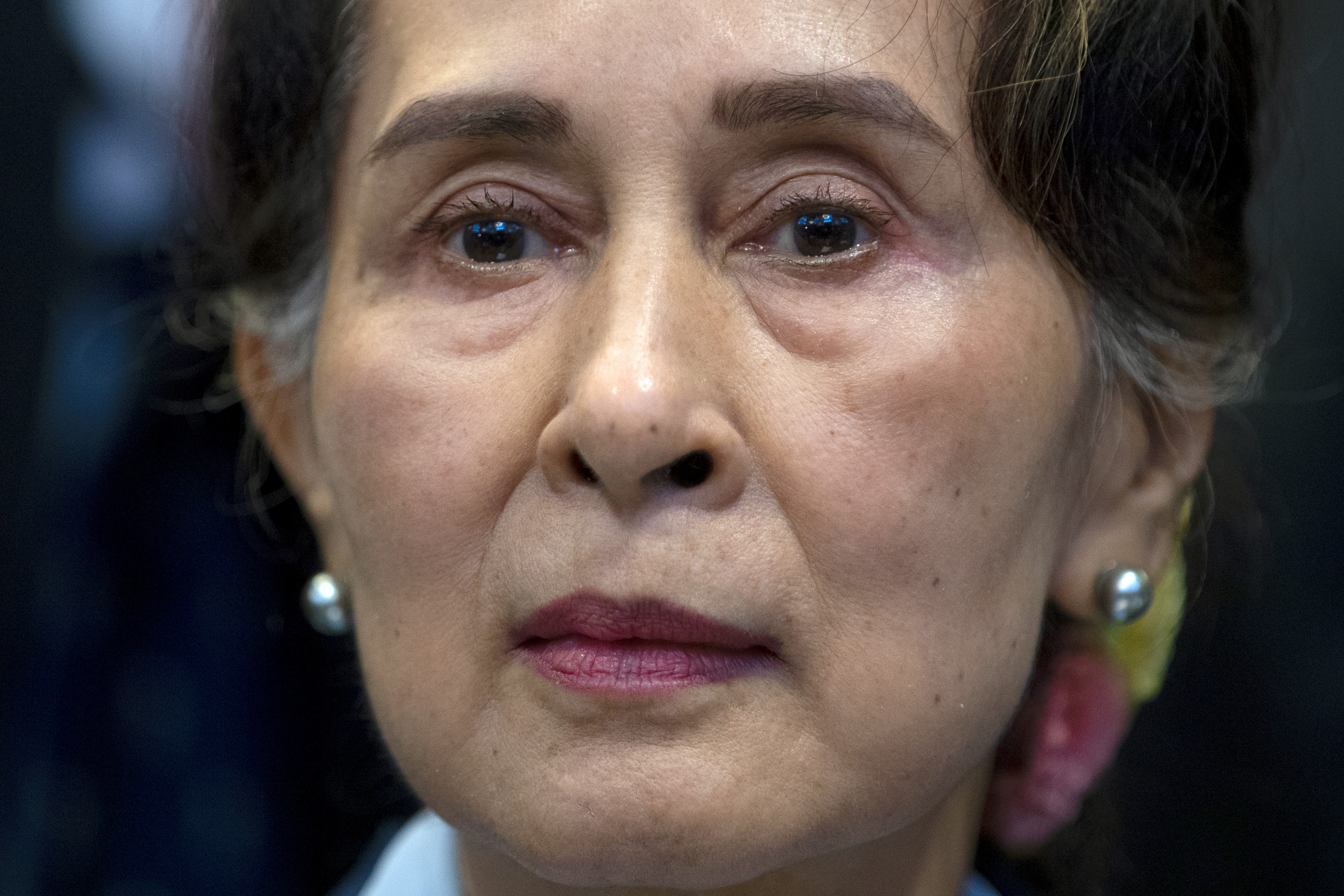 FILE - Myanmar's then eader Aung San Suu Kyi waits to address judges of the International Court of Justice on the second day of three days of hearings in The Hague, Netherlands, Dec. 11, 2019. (AP Photo/Peter Dejong, File)