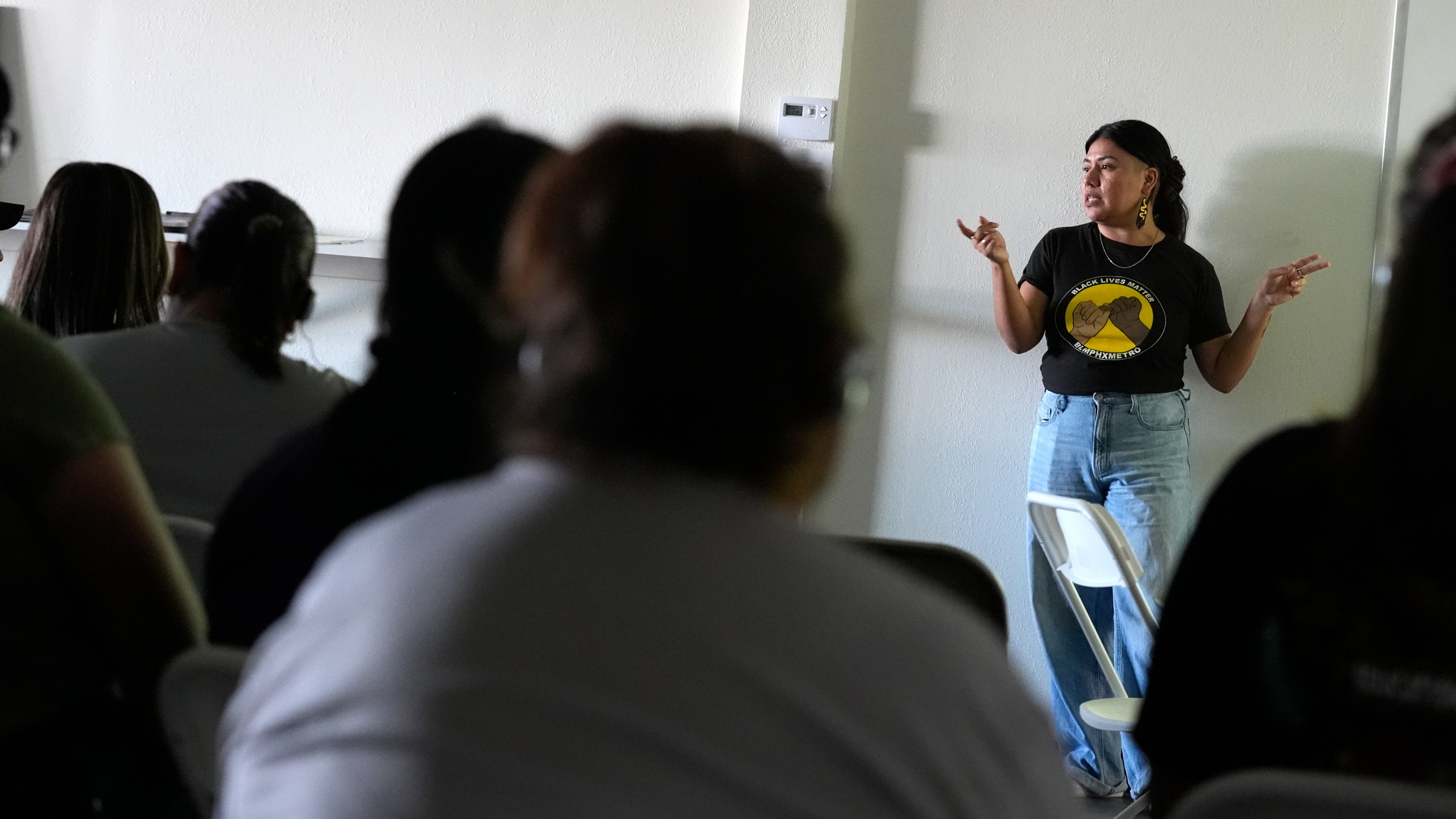 Viridiana Hernandez, Executive Director of Poder In Action, speaks during a canvassing event Tuesday, Sept. 3, 2024, in Phoenix. (AP Photo/Ross D. Franklin)