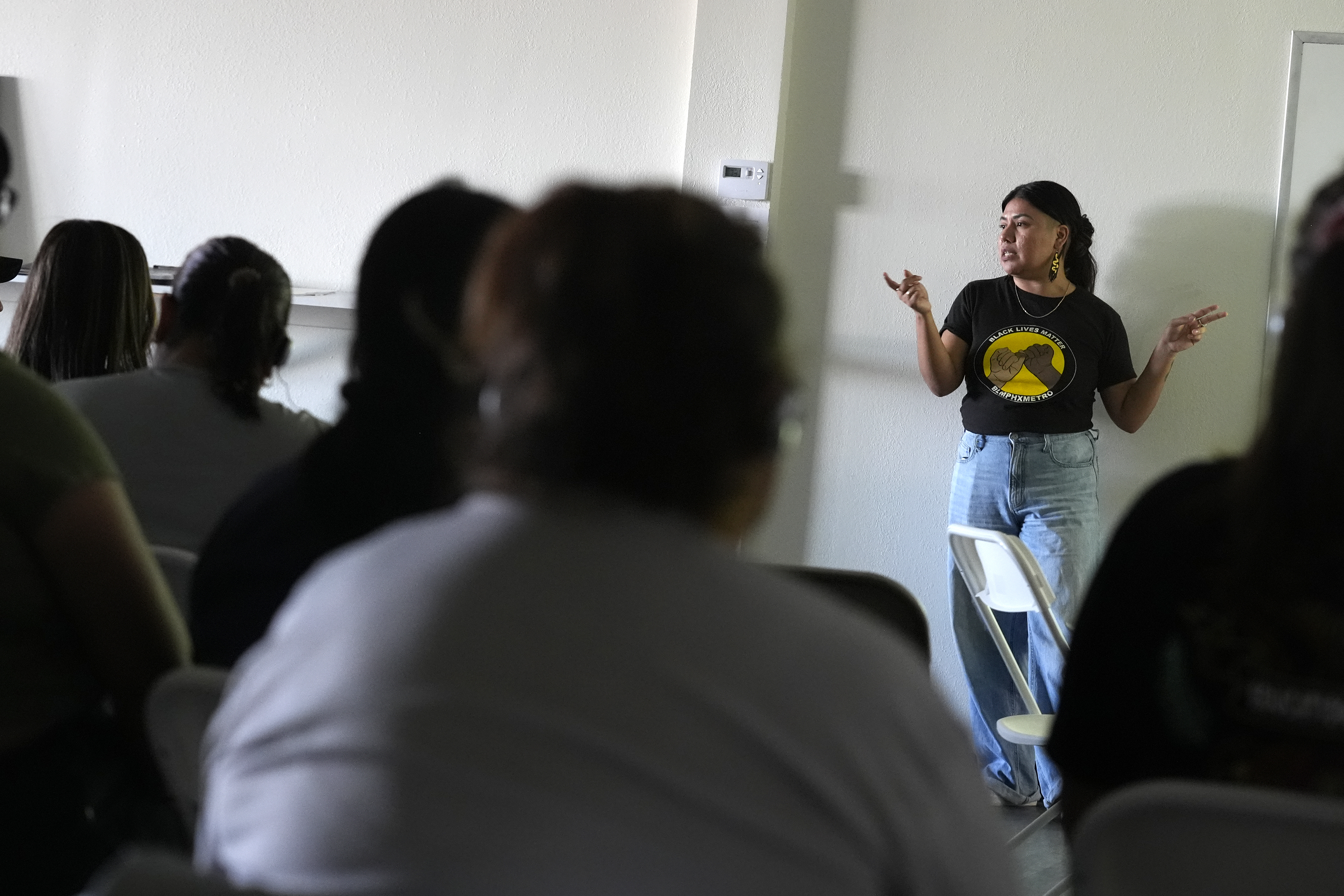 Viridiana Hernandez, Executive Director of Poder In Action, speaks during a canvassing event Tuesday, Sept. 3, 2024, in Phoenix. (AP Photo/Ross D. Franklin)