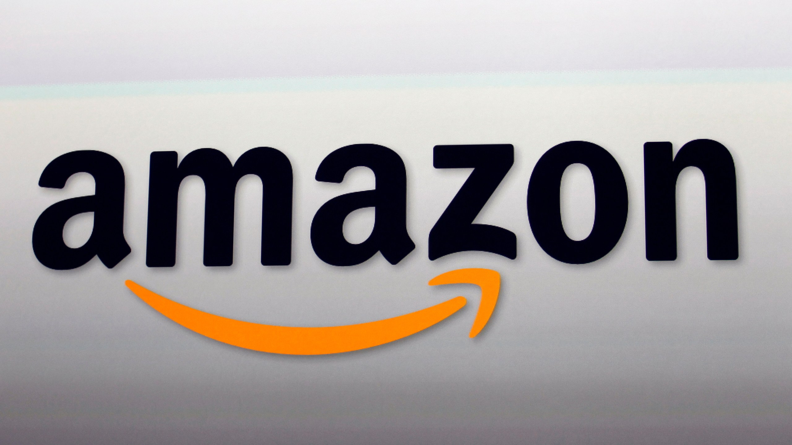 FILE - The Amazon logo is seen in Santa Monica, Calif., Sept. 6, 2012. (AP Photo/Reed Saxon, File)