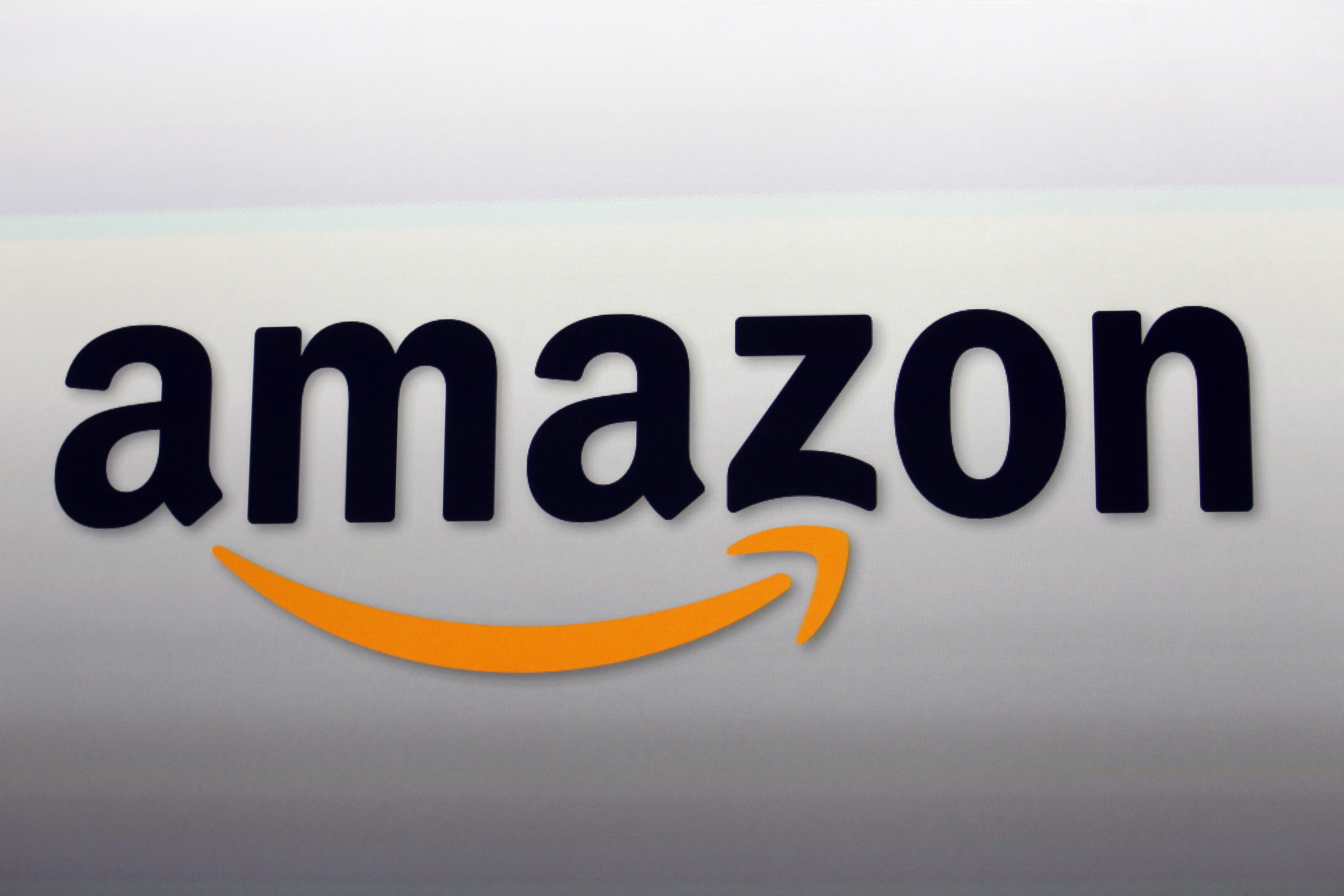 FILE - The Amazon logo is seen in Santa Monica, Calif., Sept. 6, 2012. (AP Photo/Reed Saxon, File)