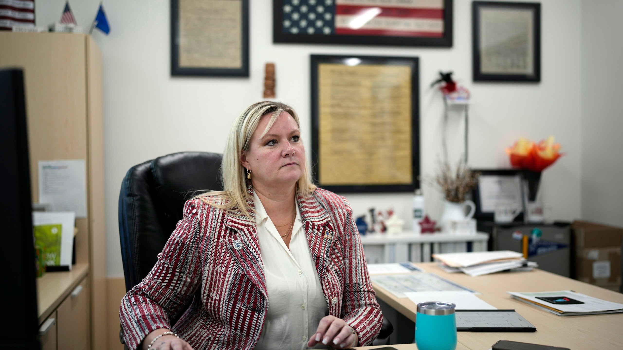 Cari-Ann Burgess, interim Registrar of Voters for Washoe County, Nev., sits in her office Sept. 20, 2024, in Reno, Nev. (AP Photo/John Locher)