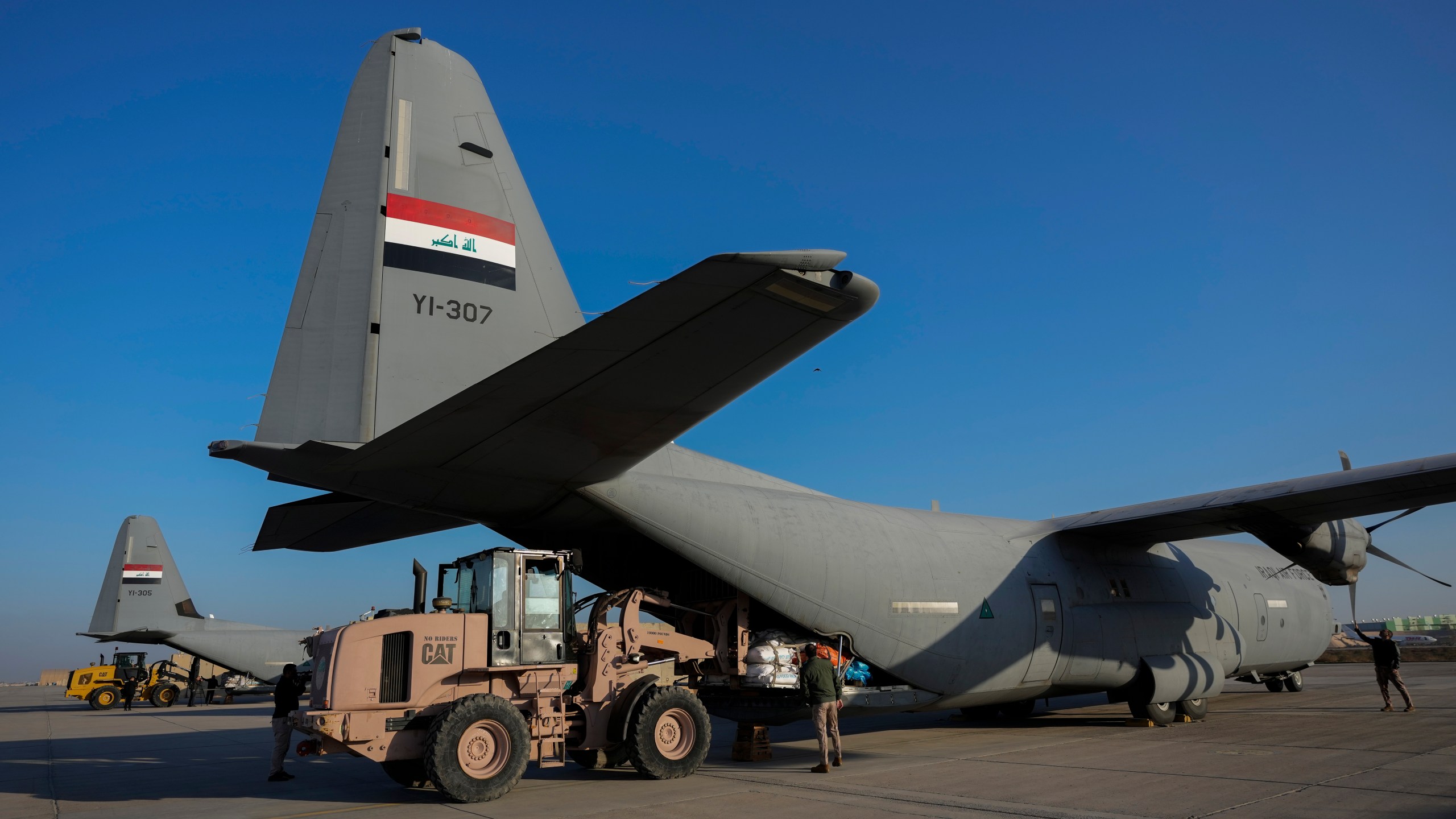 FILE - Iraqi security forces prepare for loading humanitarian aid from Red Crescent for Palestinians in Gaza, before its departure from a military airbase near Baghdad International Airport in Baghdad, Iraq, Jan. 24, 2024. (AP Photo/Hadi Mizban, File)