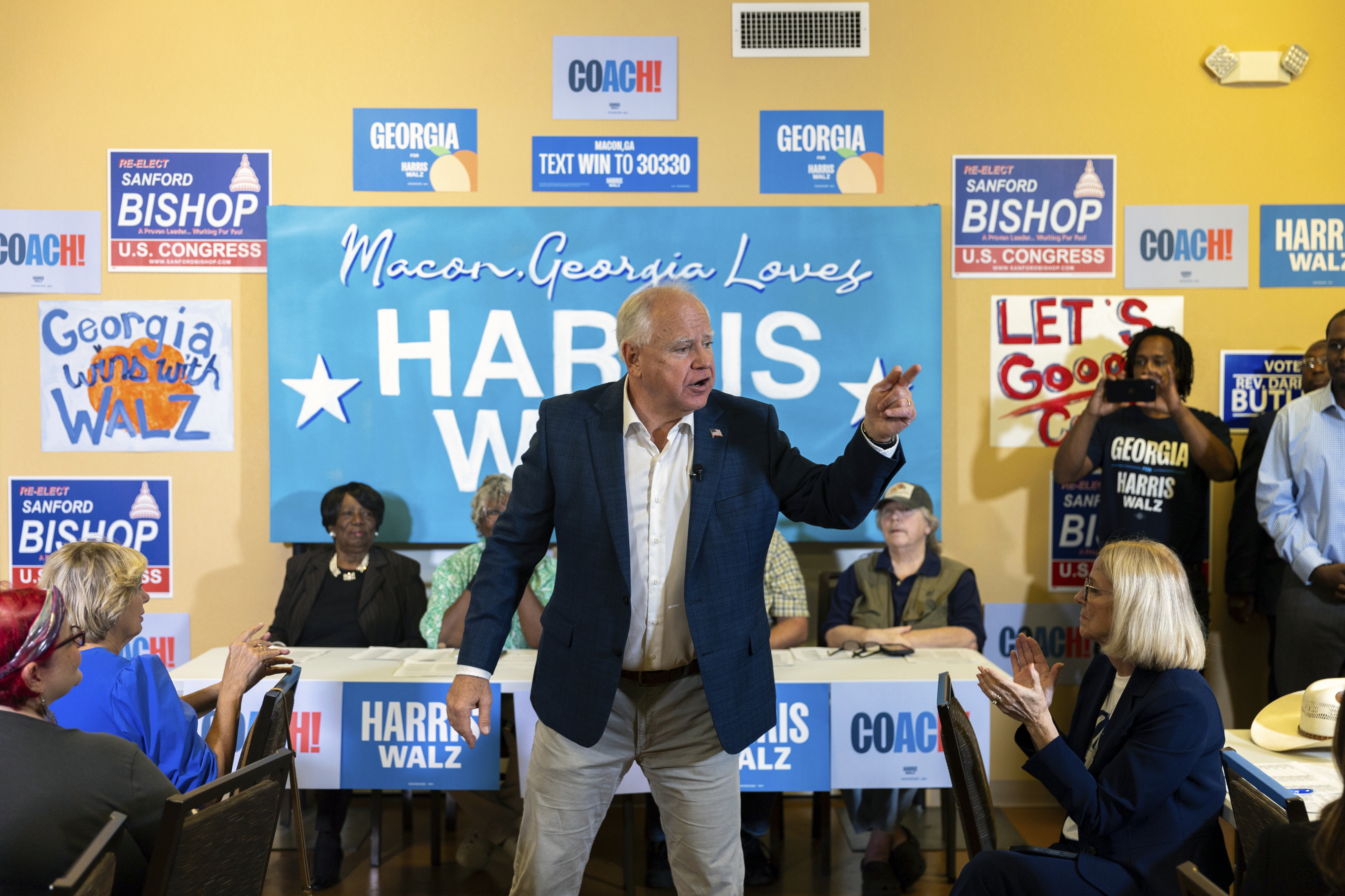 Democratic vice presidential candidate Tim Walz speaks to supporters at a Democratic campaign office in Macon, Ga., Tuesday, Sept. 17, 2024. (Arvin Temkar/Atlanta Journal-Constitution via AP)