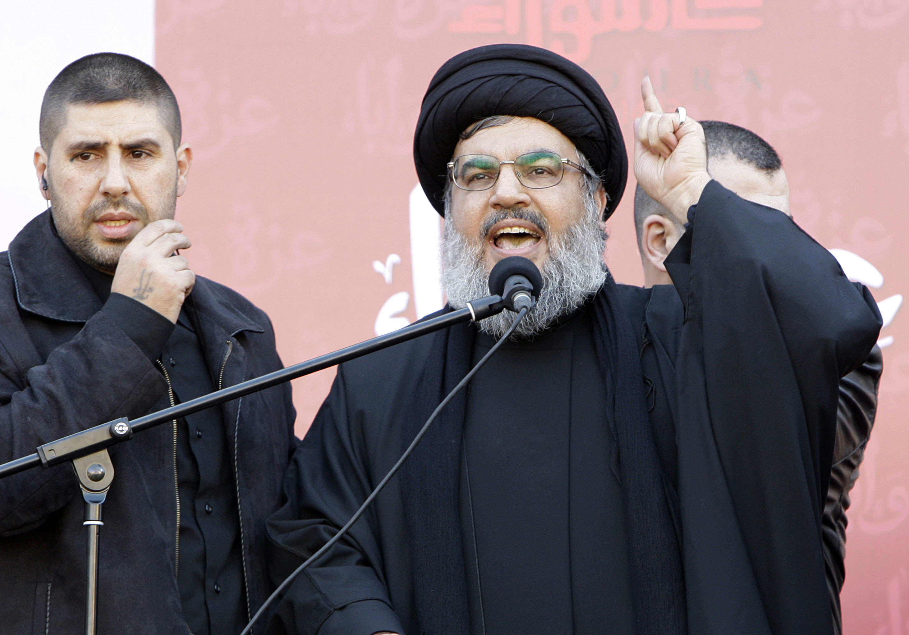 FILE - Hezbollah leader Hassan Nasrallah speaks to the crowd in a rare public appearance during a rally to mark the Muslim holy day of Ashoura, in Beirut's southern suburbs, Tuesday Dec. 6, 2011. (AP Photo/Bilal Hussein, File)