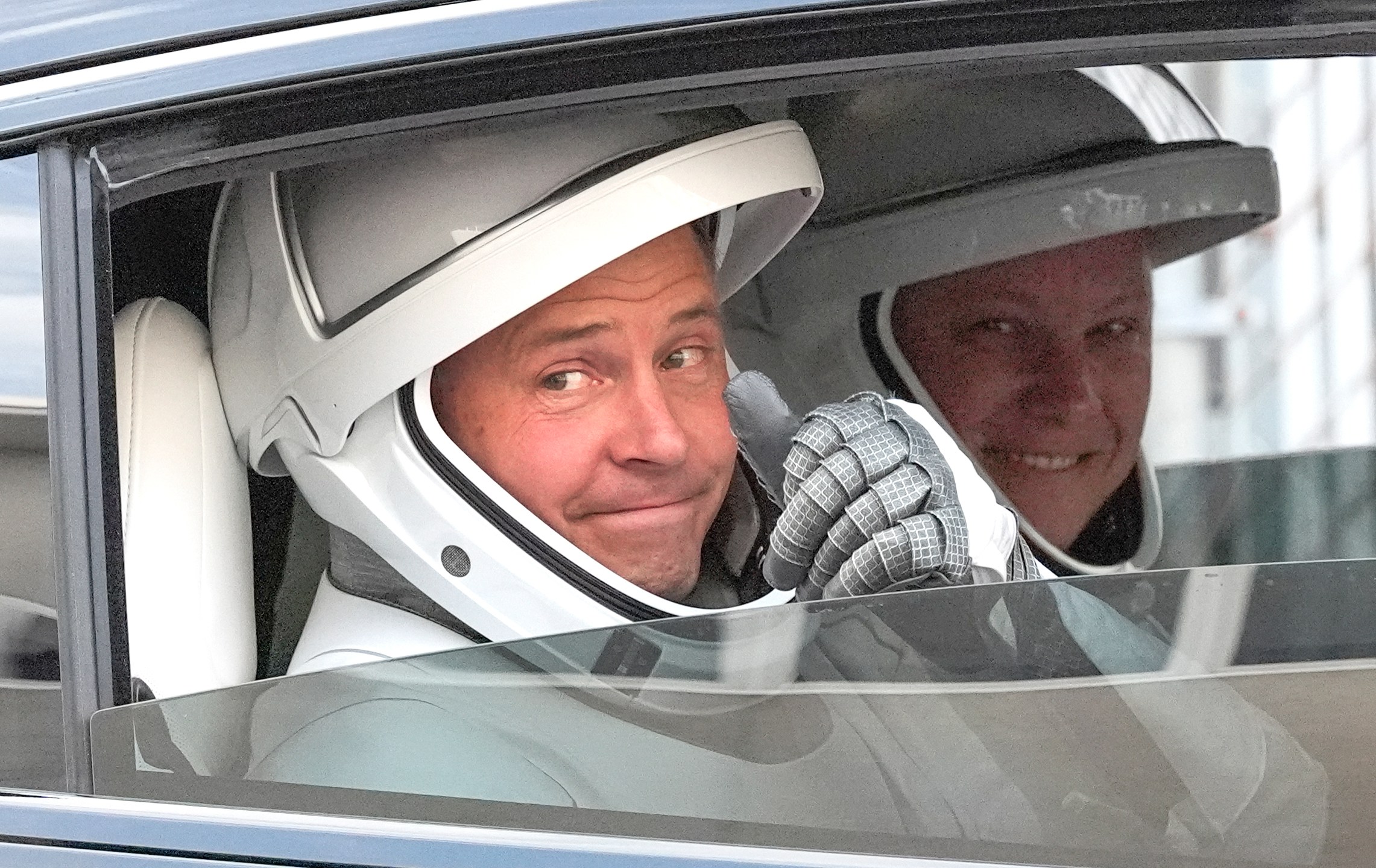 NASA astronaut Nick Hague, left, and Roscosmos cosmonaut Aleksandr Gorbunov, left, gives a thumbs up as they leave the Operations and Checkout Building on their way to Launch Complex 40 for a mission to the International Space Station Saturday, Sept. 28, 2024 at Cape Canaveral, Fla., (AP Photo/John Raoux)