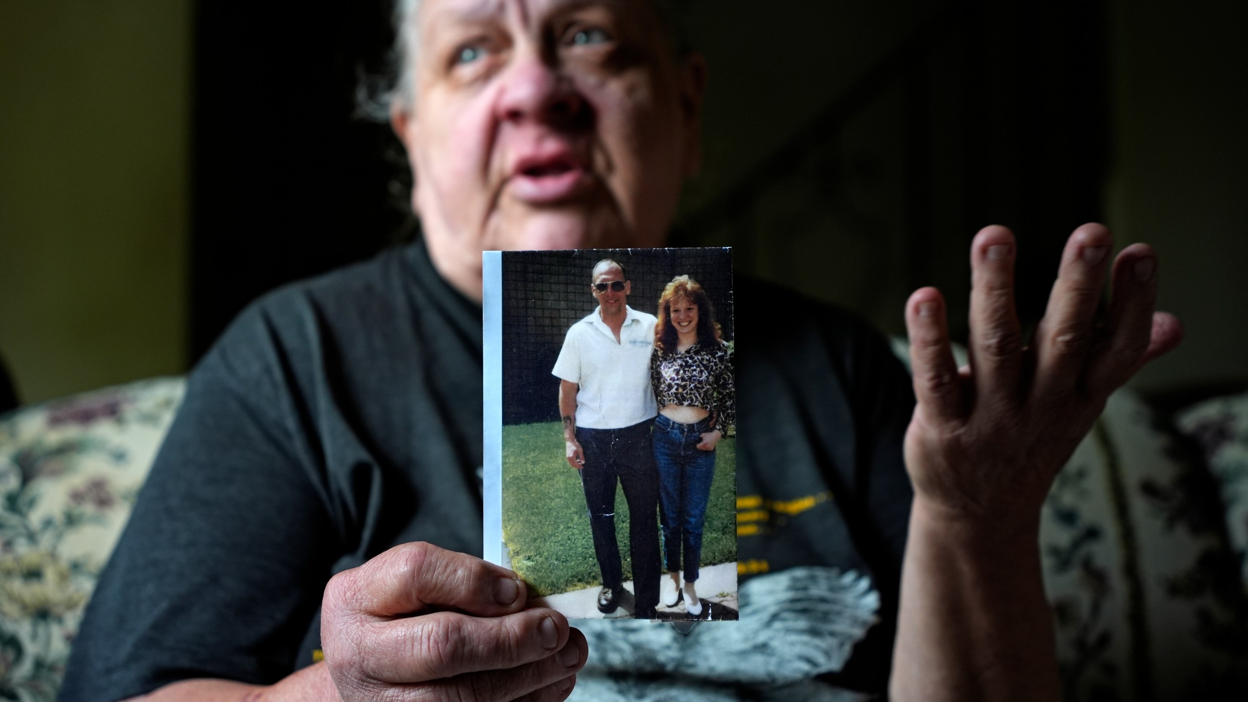 Suzy Patton holds a photo of her brother Steve Szarewicz, who insists he was wrongly convicted of a 1981 murder based on the testimony of four jailhouse informants, in her home in New Kensington, Pa, on Tuesday, April 30, 2024. (AP Photo/Gene J. Puskar)