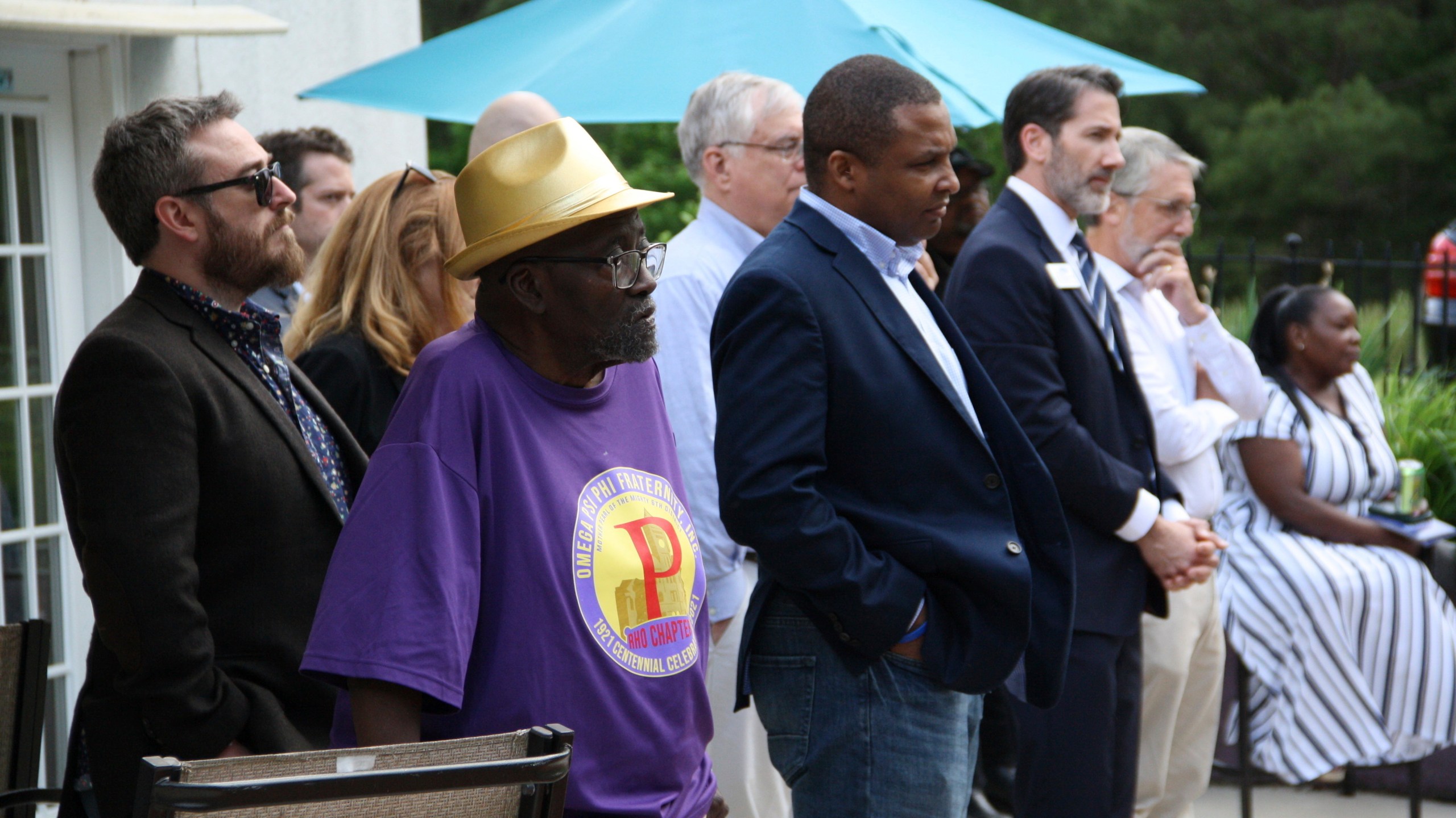 FILE - Democratic candidates Rep. Don Davis and state Rep. Terence Everitt listen to speakers at the Granville County Democratic Party fundraiser in Oxford, N.C., while standing among other attendees May 10, 2024. (AP Photo/Makiya Seminera, File)