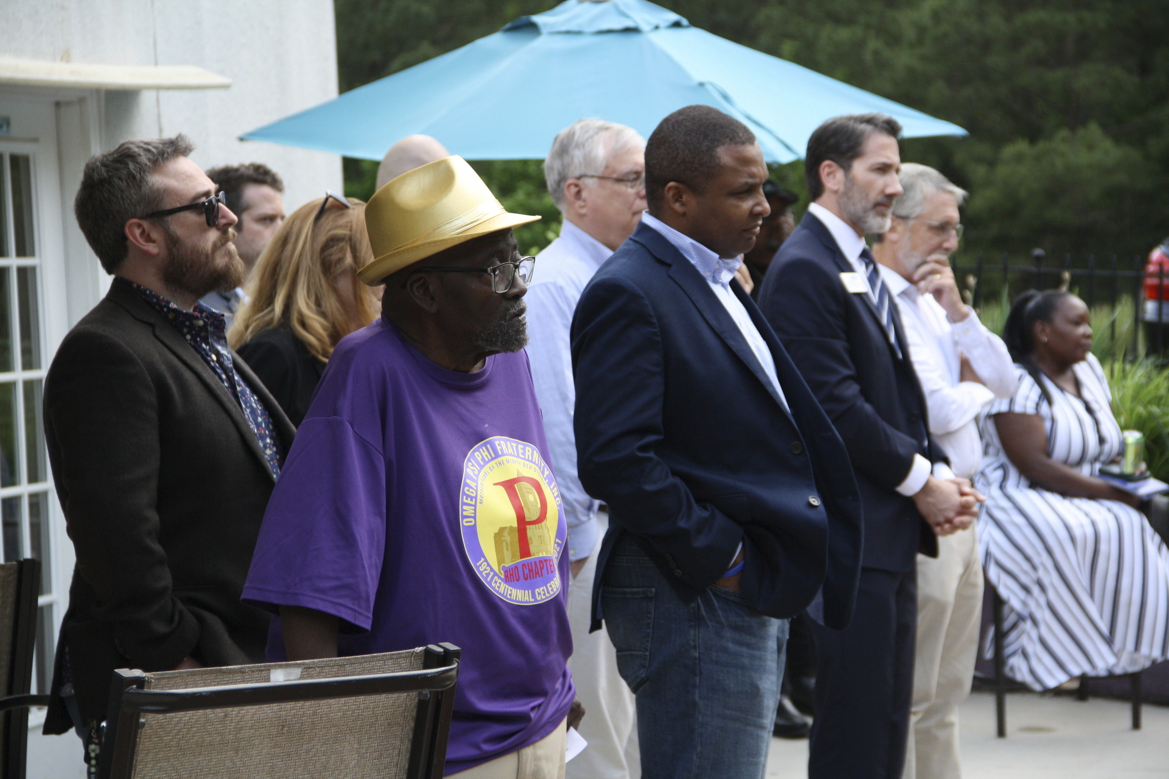 FILE - Democratic candidates Rep. Don Davis and state Rep. Terence Everitt listen to speakers at the Granville County Democratic Party fundraiser in Oxford, N.C., while standing among other attendees May 10, 2024. (AP Photo/Makiya Seminera, File)