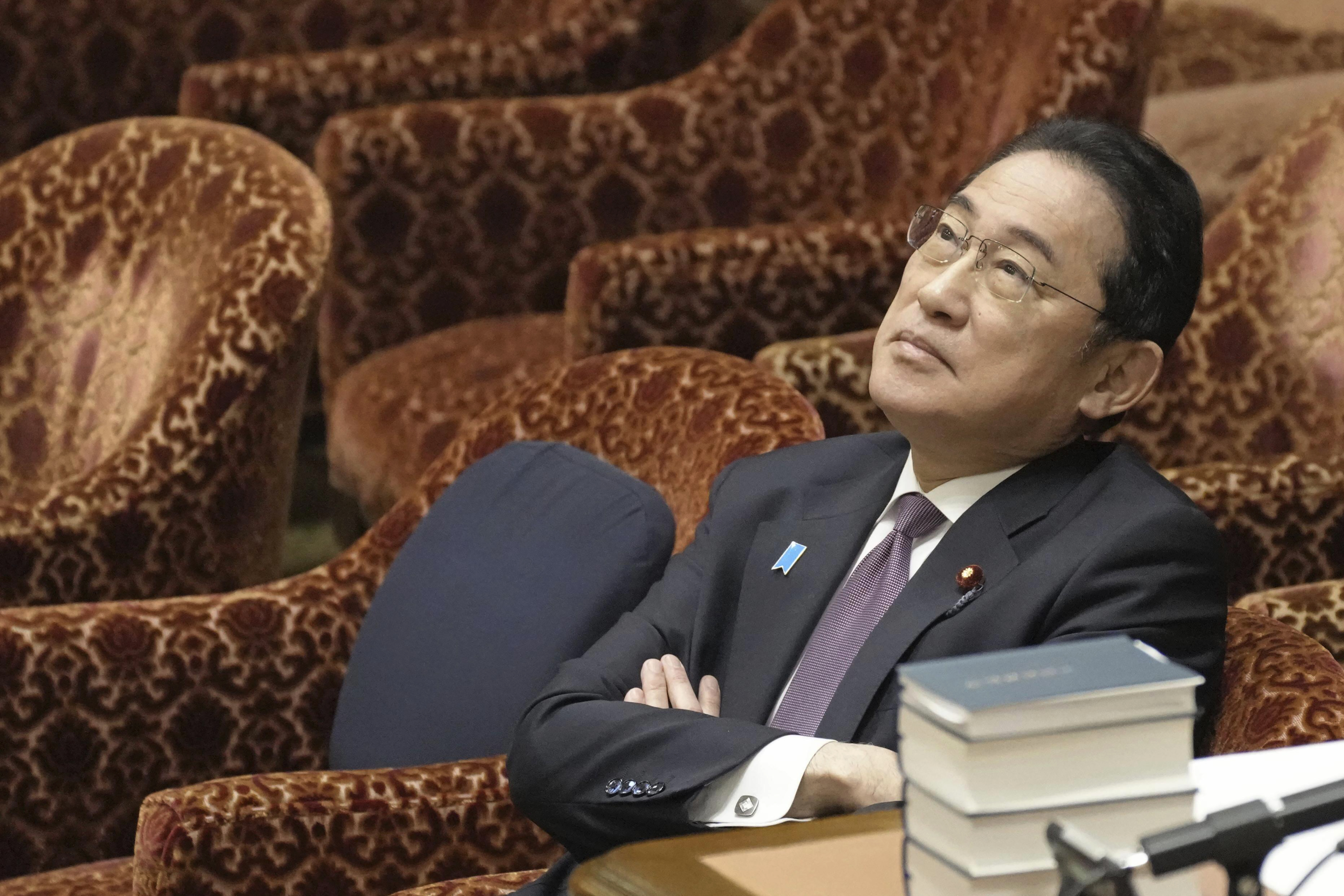 FILE - Japan's Prime Minister Fumio Kishida waits for the start of a budget committee's meeting in Tokyo on March 1, 2024, where two former cabinet ministers belonging to Japan's governing party's key faction behind a major corruption scandal that has rocked the government renewed denial they had any role in running slush funds. (Kyodo News via AP, File)