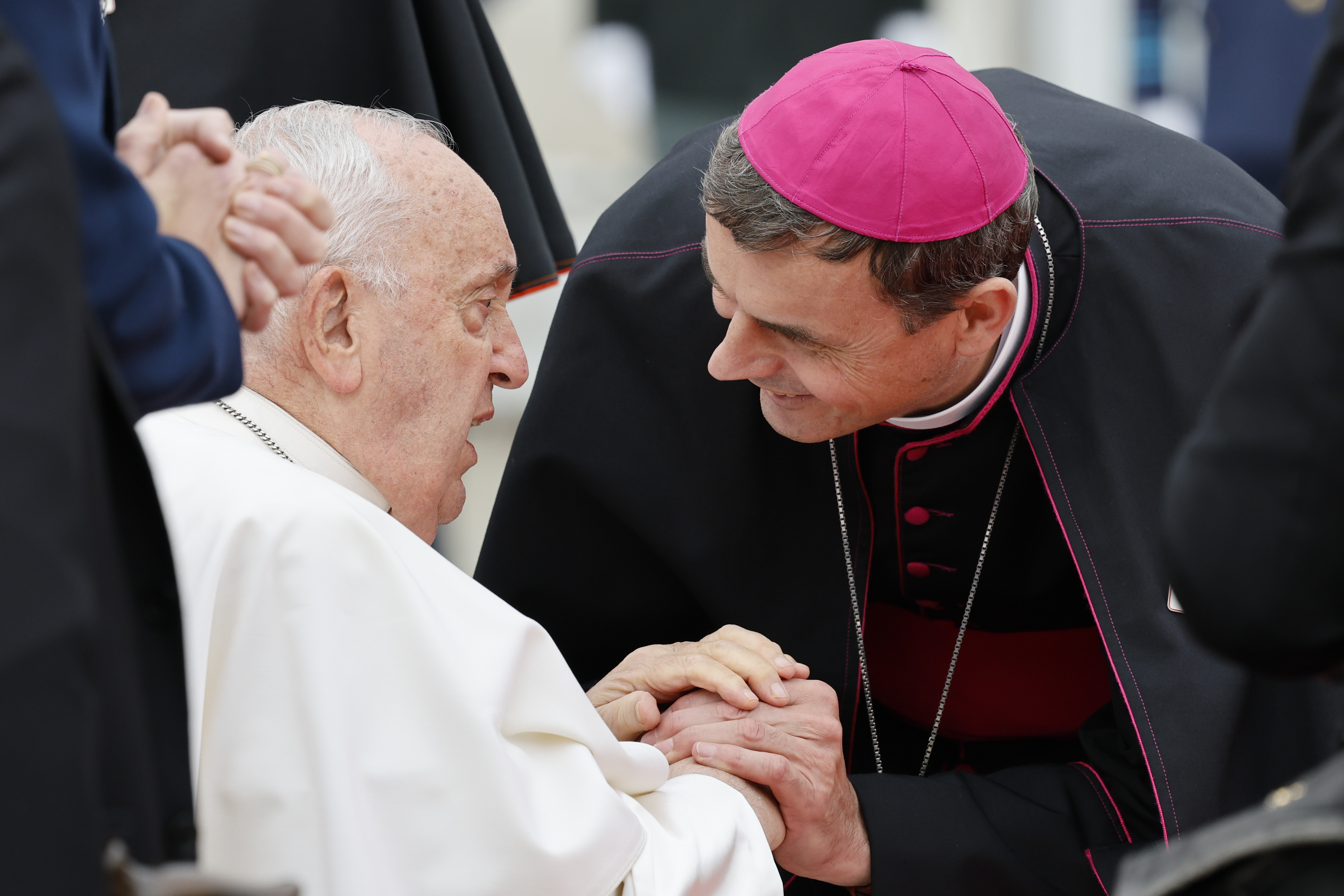 Pope Francis is greeted by Archbishop Luc Terlinden during the farewell ceremony at Melsbroek Air Base at the end of a four-day visit to Belgium and Luxembourg, Sunday, Sept. 29, 2024. (AP Photo/Geert Vanden Wijngaert)