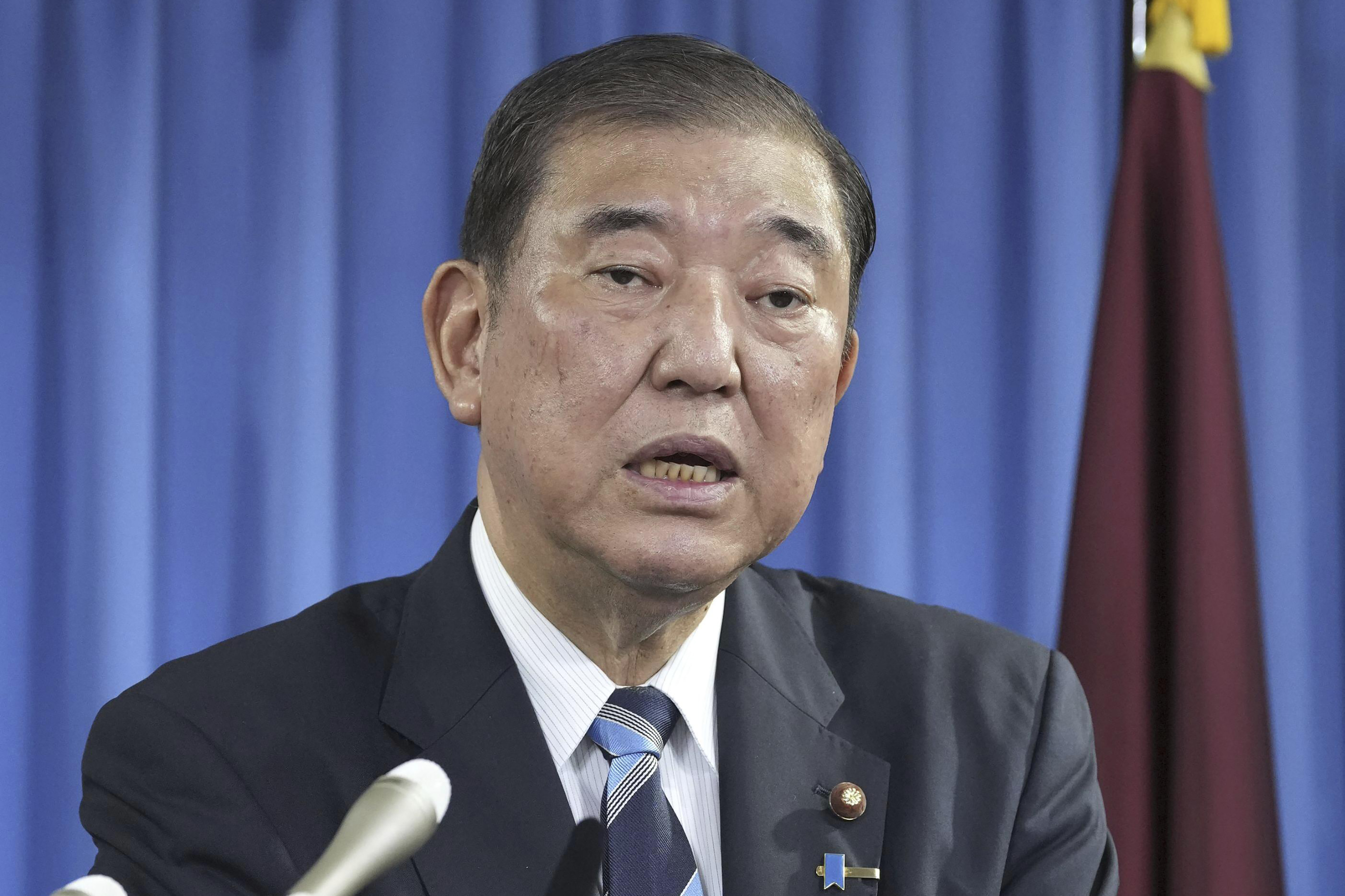 Shigeru Ishiba, the head of Japan's governing party, the Liberal Democratic Party speaks during a press conference at the party's headquarters in Tokyo Monday, Sept. 30, 2024 to announce that he plans to call a parliamentary election on Oct. 27 after he is formally elected as prime minister. (Kyodo News via AP)