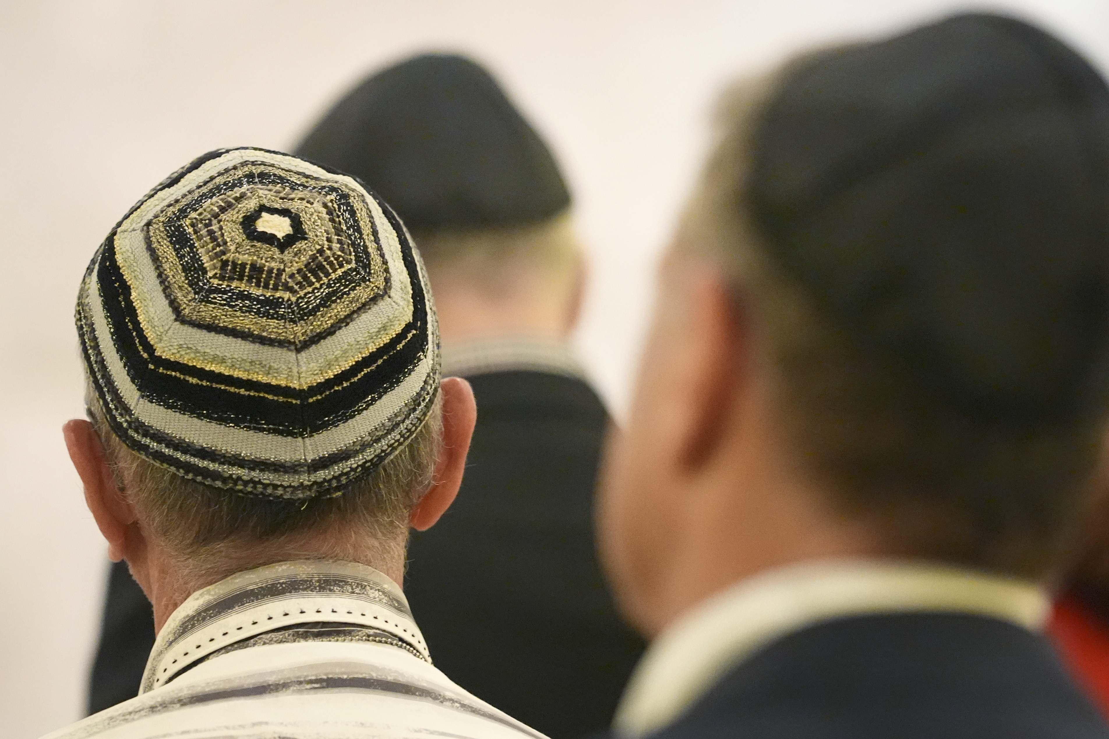 Men wear yarmulkes as they attend a Shabbat service, Friday, Sept. 27, 2024, at Temple Beth Sholom in Miami Beach, Fla. (AP Photo/Wilfredo Lee)