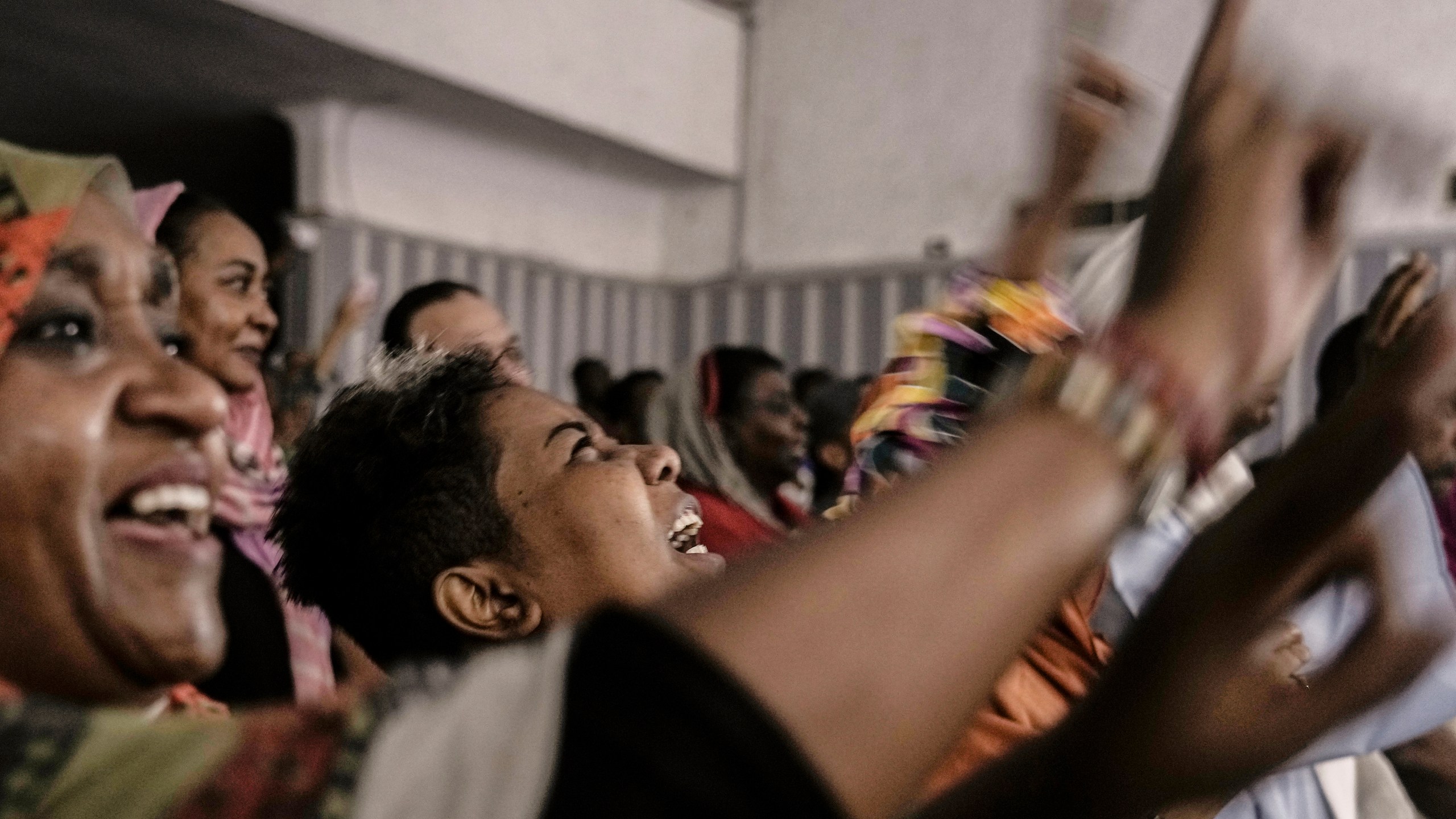 Sudanese refugees sitting in the audience cry as they watch Camirata troupe traditional show at the Russian culture center in Cairo, Egypt, Sunday, Sept. 15, 2024. (AP Photo/Amr Nabil)