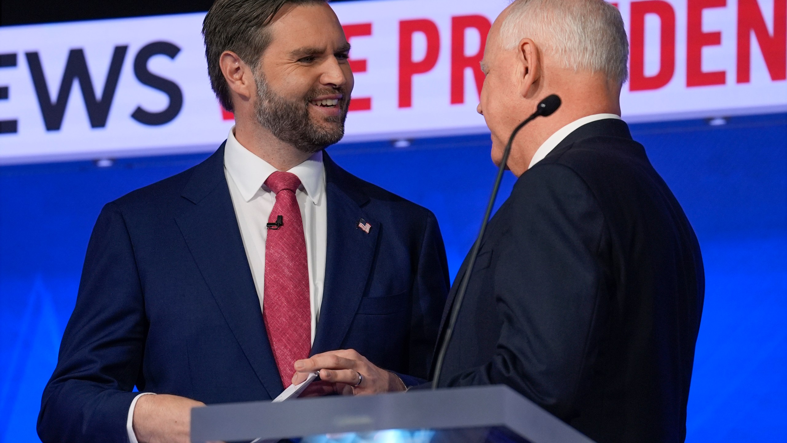 Republican vice presidential nominee Sen. JD Vance, R-Ohio, talks with Democratic vice presidential candidate Minnesota Gov. Tim Walz after the vice presidential debate hosted by CBS News Tuesday, Oct. 1, 2024, in New York. (AP Photo/Matt Rourke)