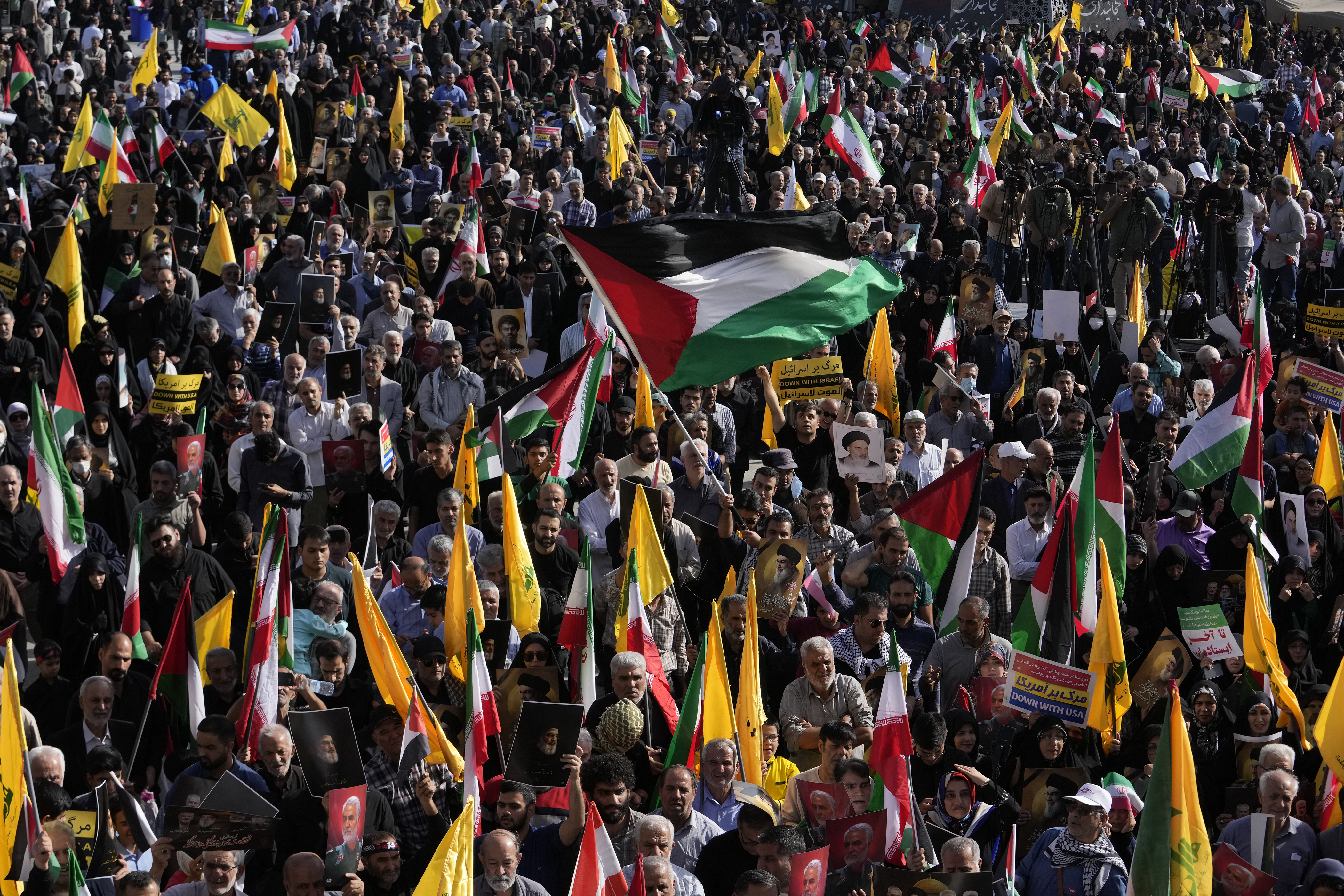 A demonstrator waves a Palestinian flag at a rally commemorating slain Hezbollah leader Hassan Nasrallah, in Tehran, Iran, Wednesday, Oct. 2, 2024. (AP Photo/Vahid Salemi)