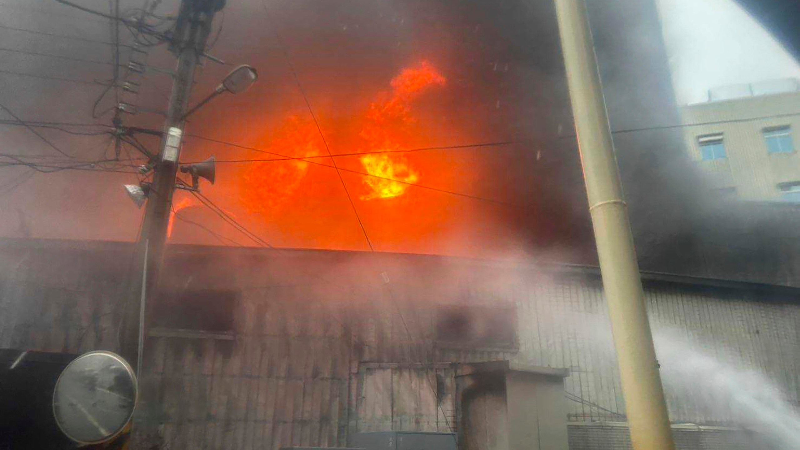 In this photo taken Oct. 3, 2024 and released by the Pingtung County Government, a fire breaks out at a hospital in Pingtung county in southern Taiwan. (Pingtung County Government via AP)