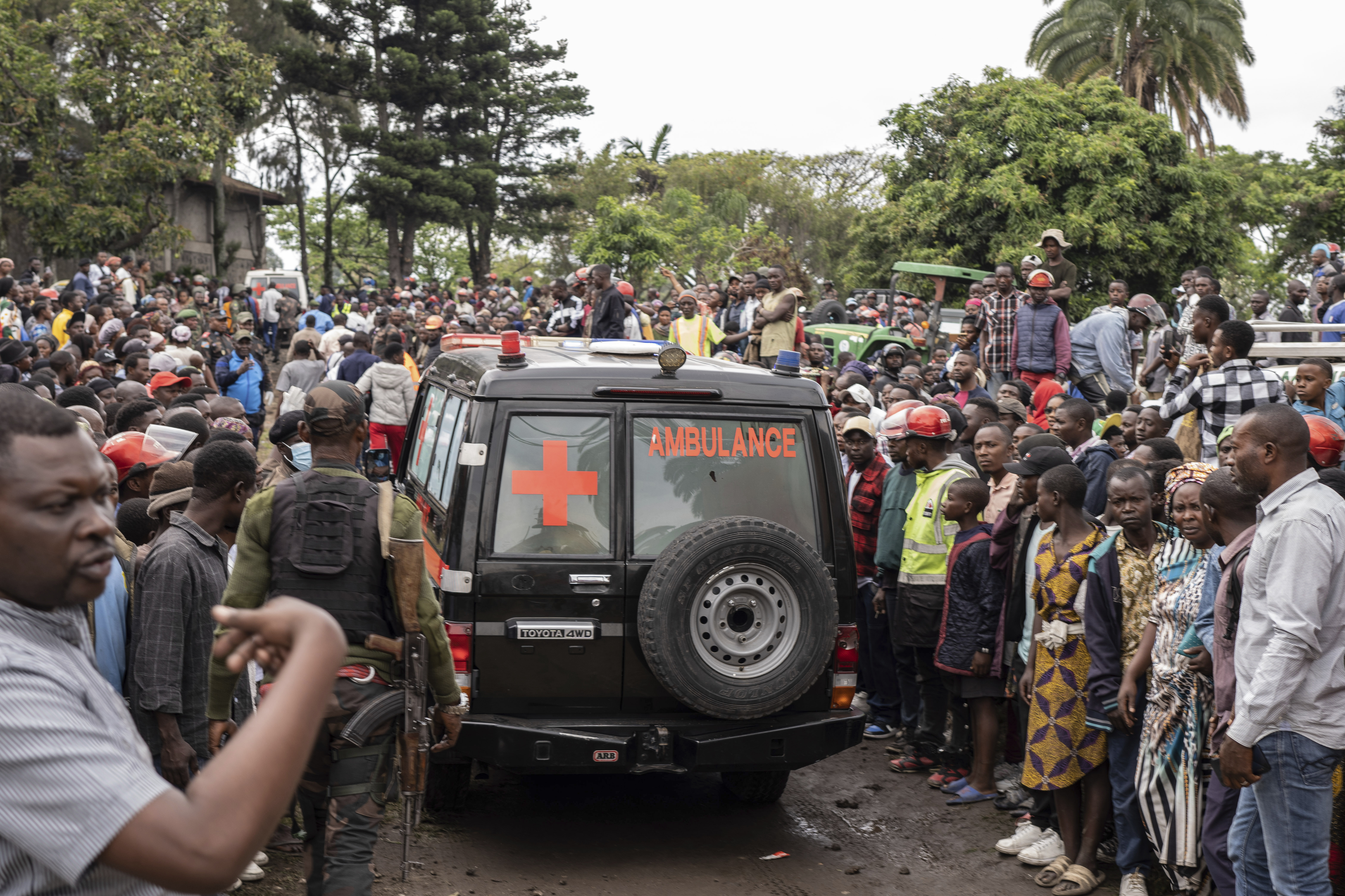 An ambulance carries victims away from the port of Goma, Democratic Republic of Congo, after a ferry carrying hundreds capsized on arrival Thursday, Oct. 3, 2024. (AP Photo/Moses Sawasawa)