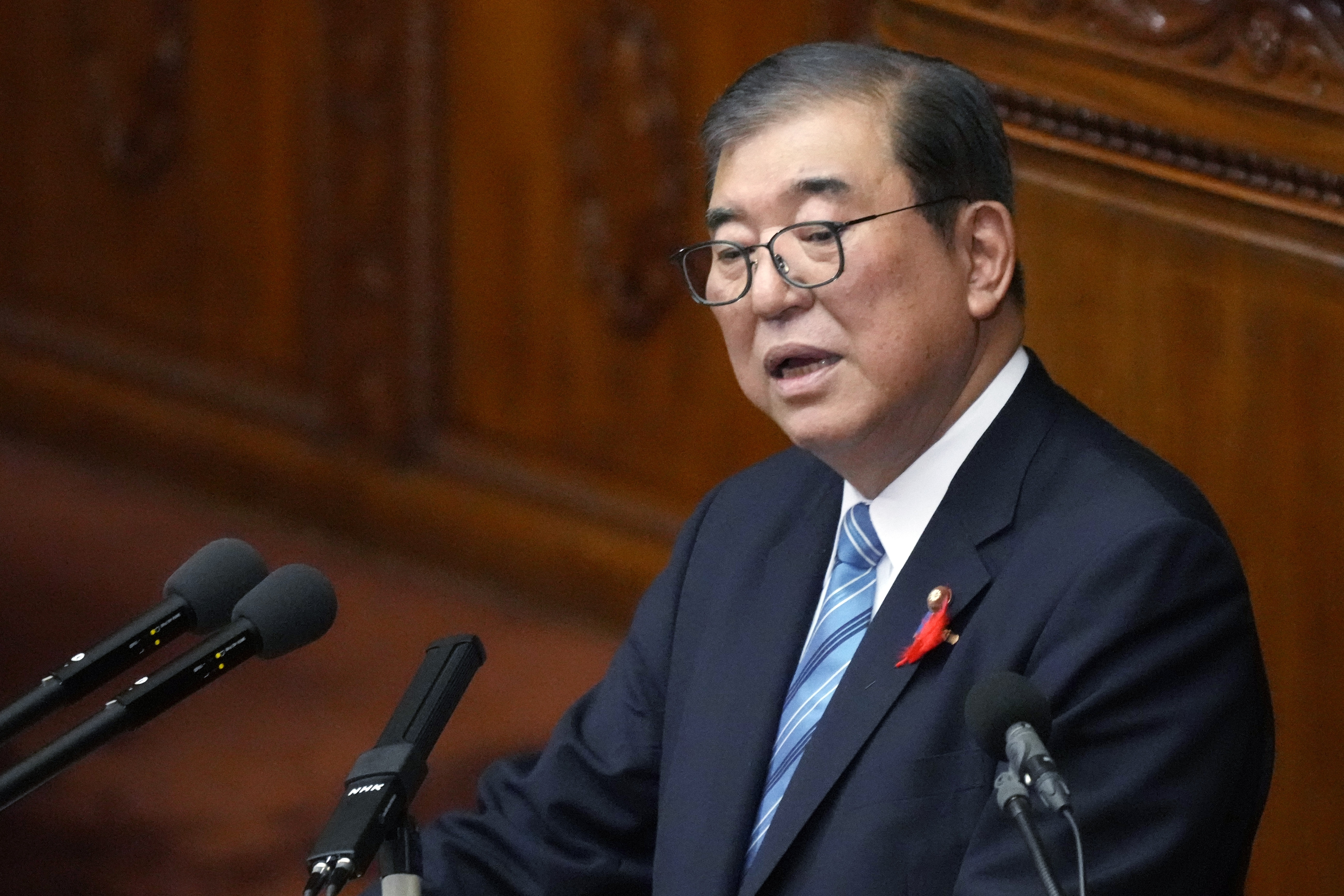 Japanese Prime Minister Shigeru Ishiba delivers his first policy speech during a Diet session at the Lower House of the Parliament Friday, Oct. 4, 2024, in Tokyo. (AP Photo/Eugene Hoshiko)