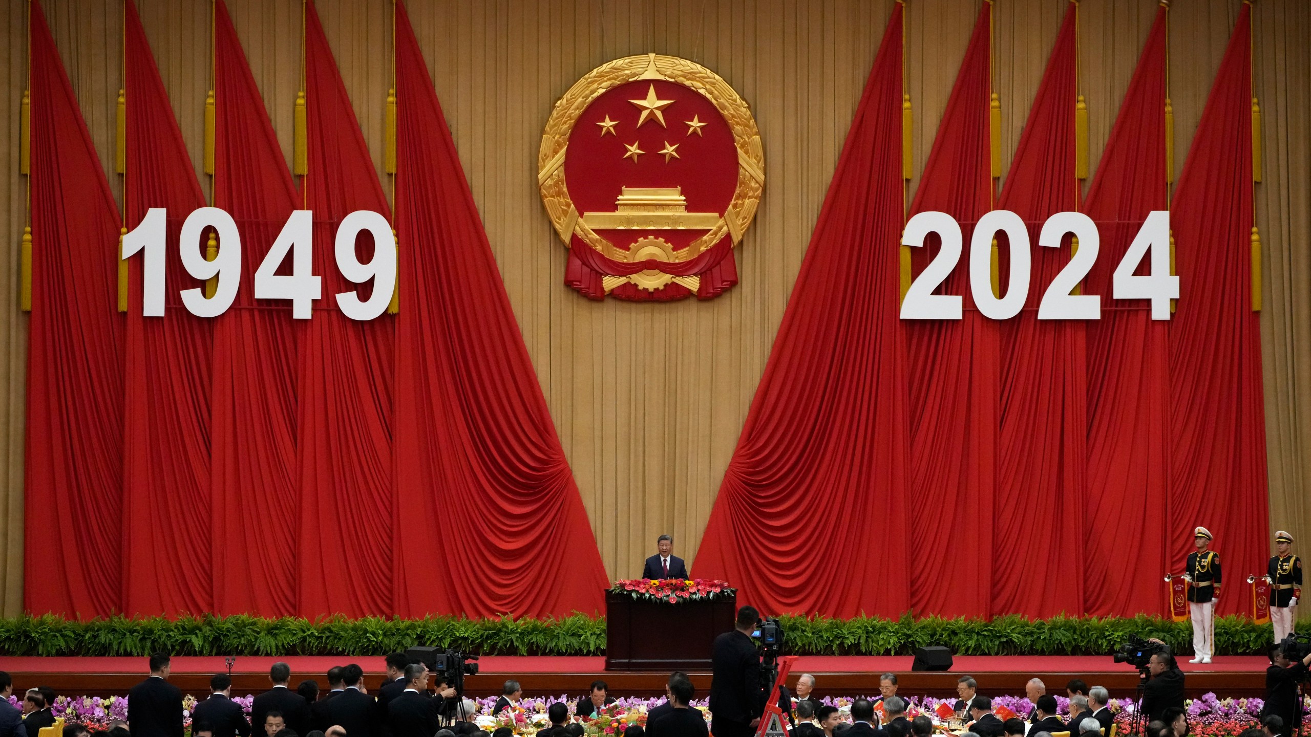 Chinese President Xi Jinping delivers his speech at a dinner marking the 75th anniversary of the founding of the People's Republic of China, at the Great Hall of the People in Beijing, Monday, Sept. 30, 2024. (AP Photo/Andy Wong)