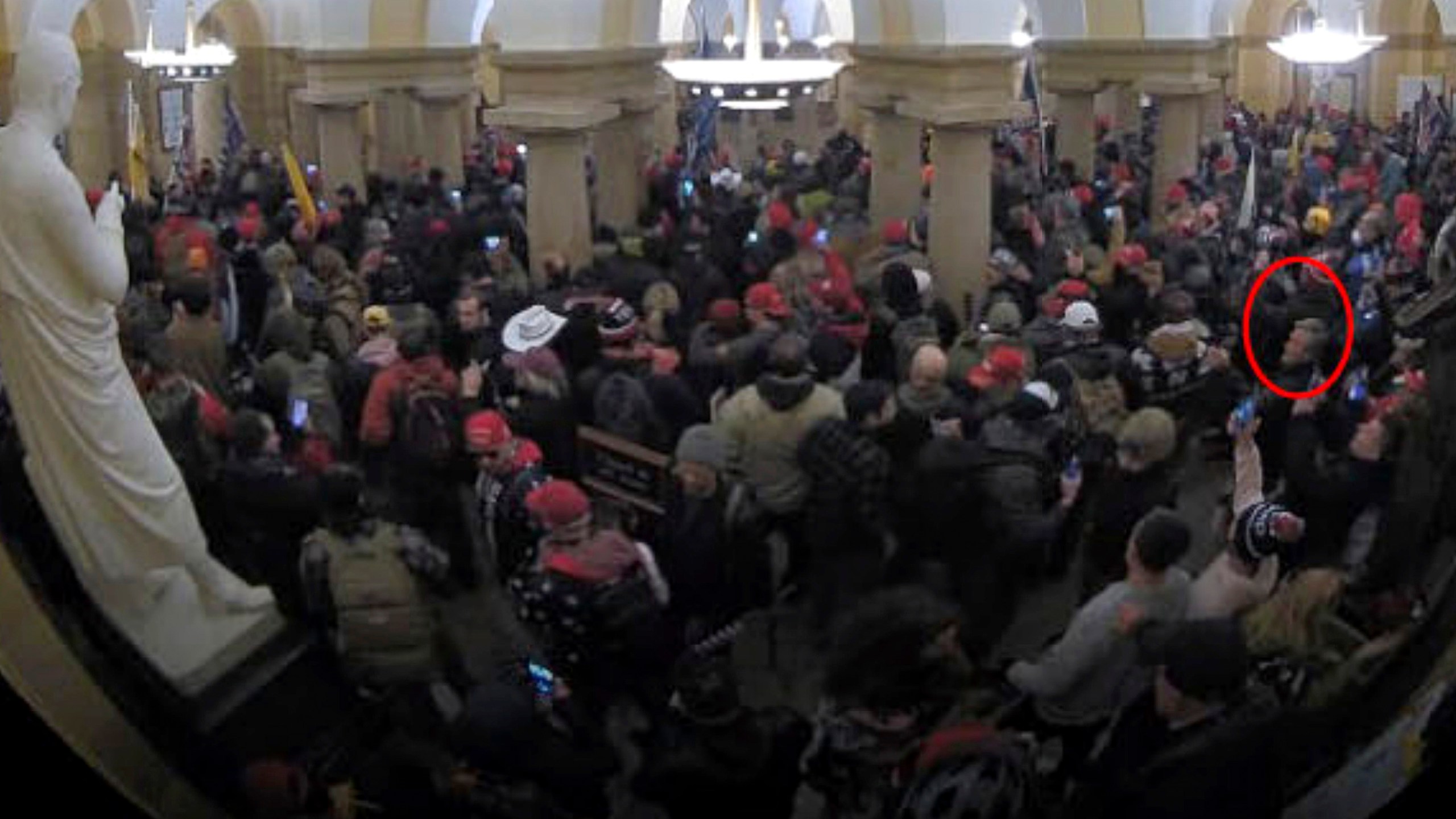 This image from security video of Michael Daniele, a retired New Jersey State Police trooper, seen in the Crypt in the U.S. Capitol on Jan. 6, 2021, was contained in the Justice Department affidavit and complaint in support of the arrest of Daniele. (Department of Justice via AP)