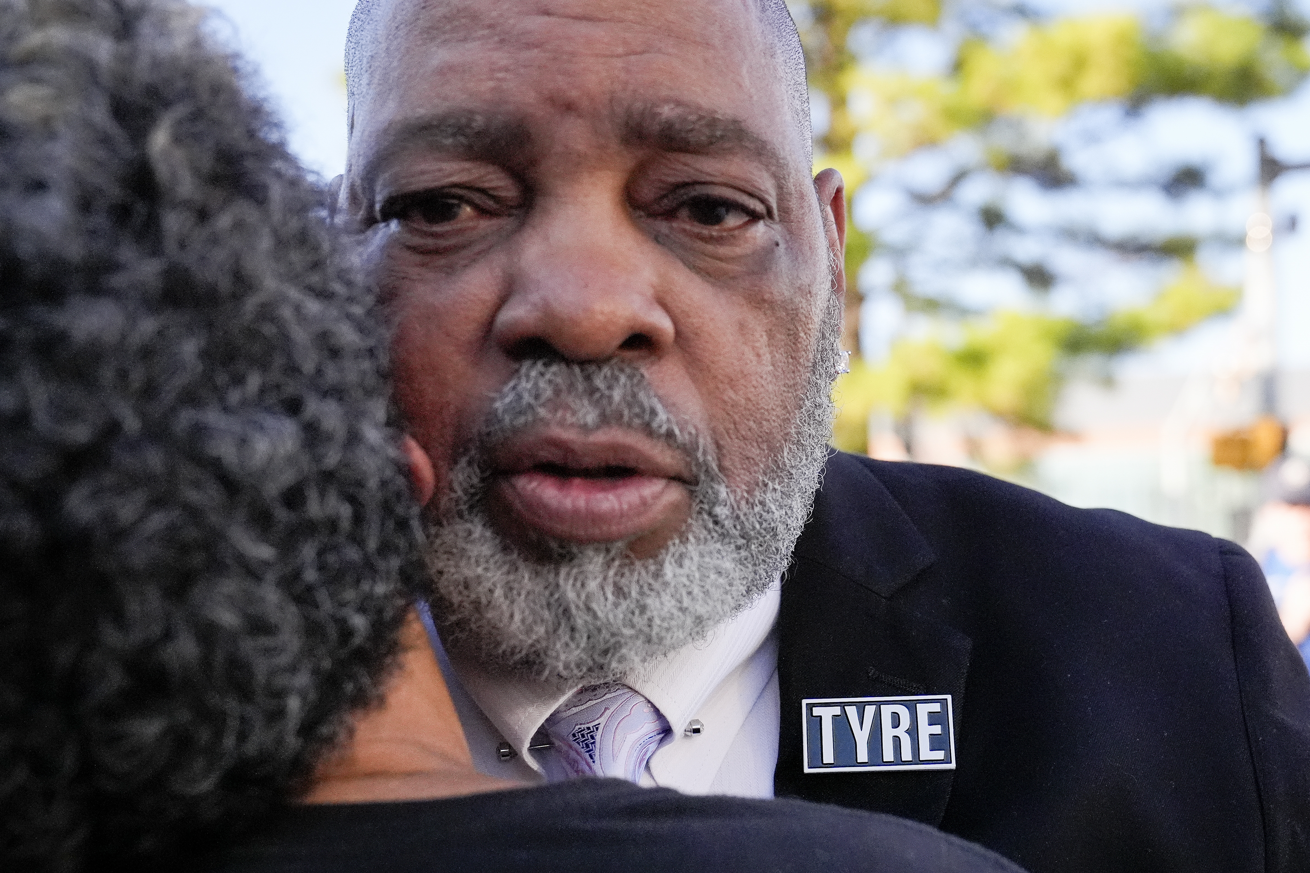 Rodney Wells, stepfather of Tyre Nichols receives a hug from a supporter as he leaves the federal courthouse after three former Memphis police officers were convicted of witness tampering charges in the 2023 fatal beating of his stepson Tyre, Thursday, Oct. 3, 2024, in Memphis, Tenn. (AP Photo/George Walker IV)