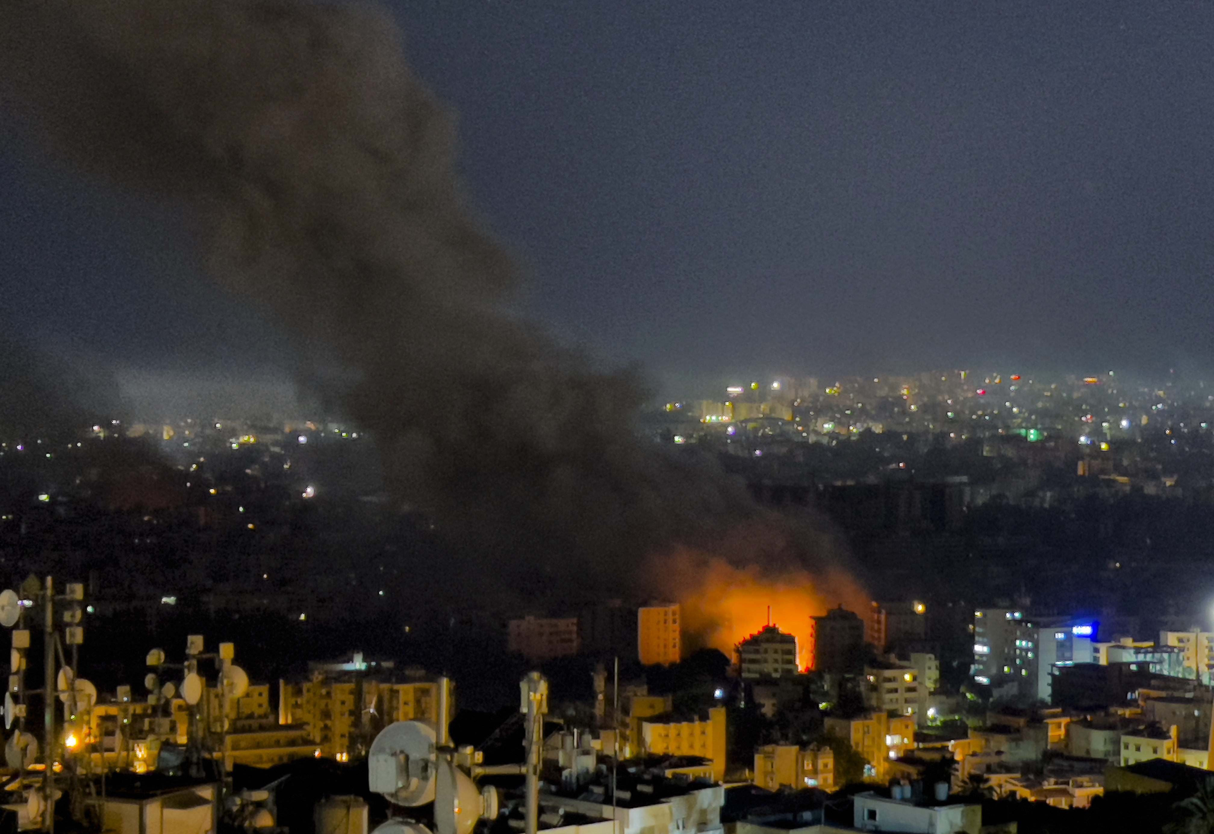 Flames and smoke rise from Israeli airstrikes in Dahiyeh, Beirut, Lebanon, Friday, Oct. 4, 2024. (AP Photo/Hussein Malla)