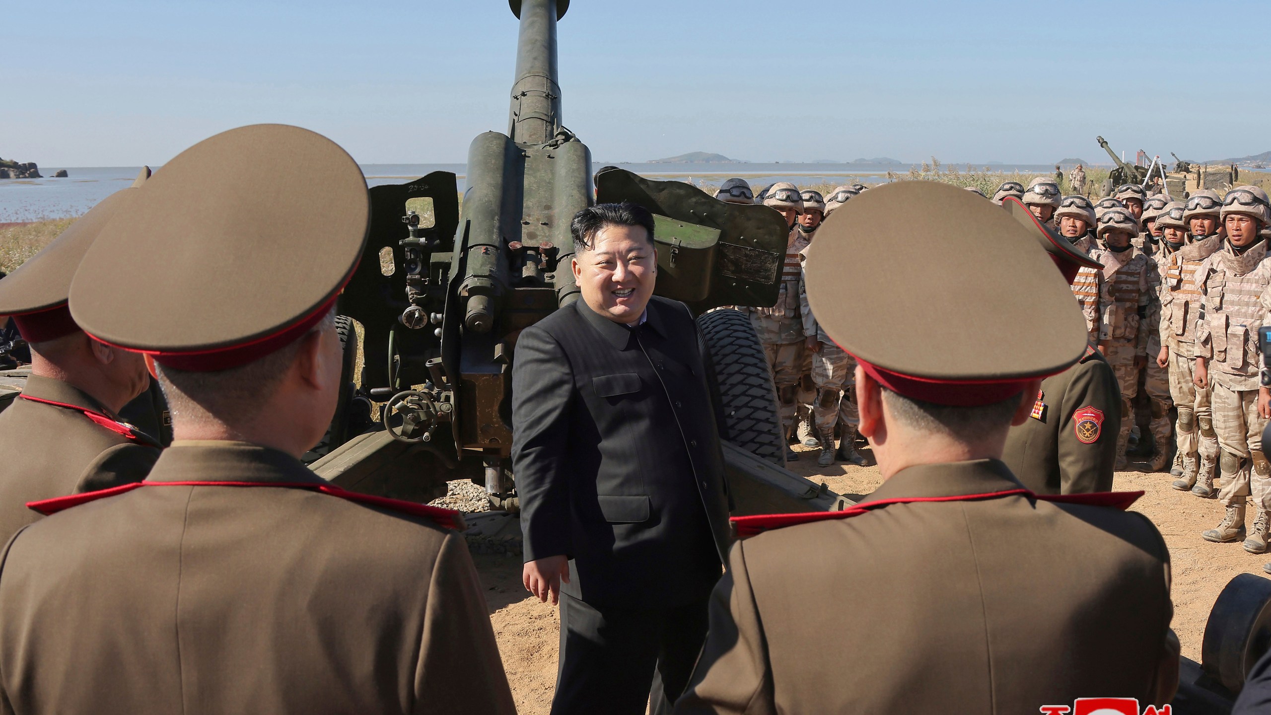 In this undated photo provided on Saturday, Oct. 6, 2024 by the North Korean government, North Korean leader Kim Jong Un, center, visits to watch an artillery exercise at an undisclosed place in North Korea. Independent journalists were not given access to cover the event depicted in this image distributed by the North Korean government. The content of this image is as provided and cannot be independently verified. Korean language watermark on image as provided by source reads: "KCNA" which is the abbreviation for Korean Central News Agency. (Korean Central News Agency/Korea News Service via AP)