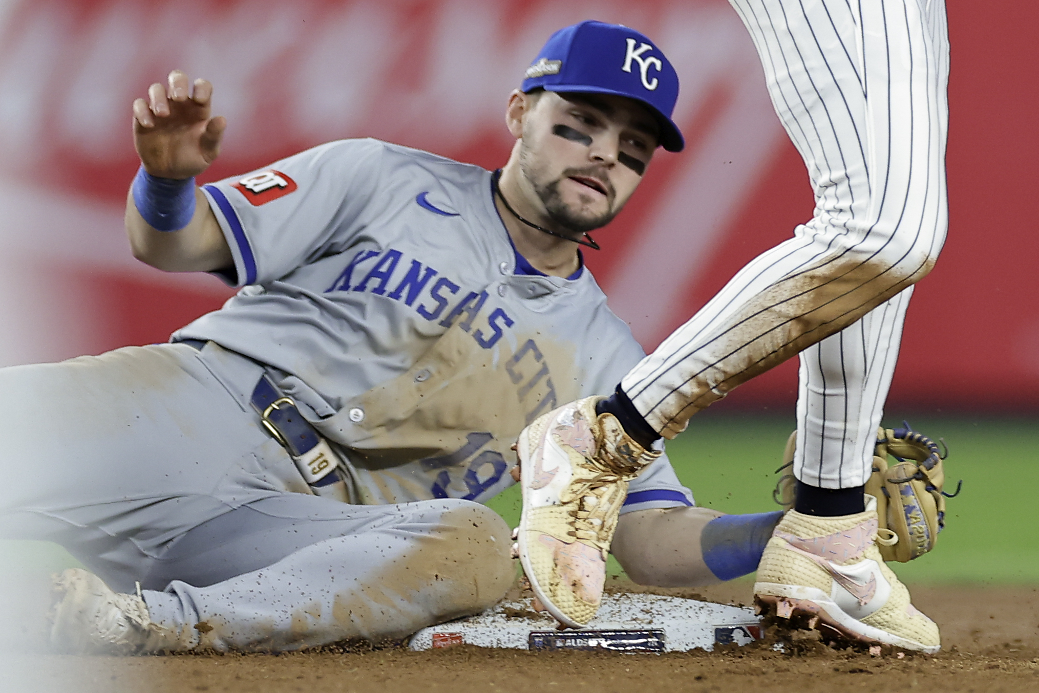 Kansas City Royals second base Michael Massey (19) can't make the tag on New York Yankees' Jazz Chisholm Jr. who stole second base during the seventh inning of Game 1 of the American League baseball division series, Saturday, Oct. 5, 2024, in New York. (AP Photo/Adam Hunger)