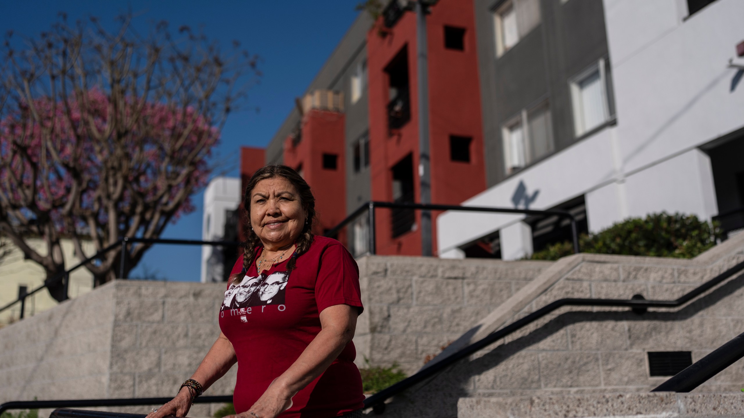 Marina Maalouf, a longtime resident of Hillside Villa who participated in protests after rents doubled in 2019, stands for a photo outside her apartment building in Los Angeles on Wednesday, Sept. 18, 2024. (AP Photo/Jae C. Hong)