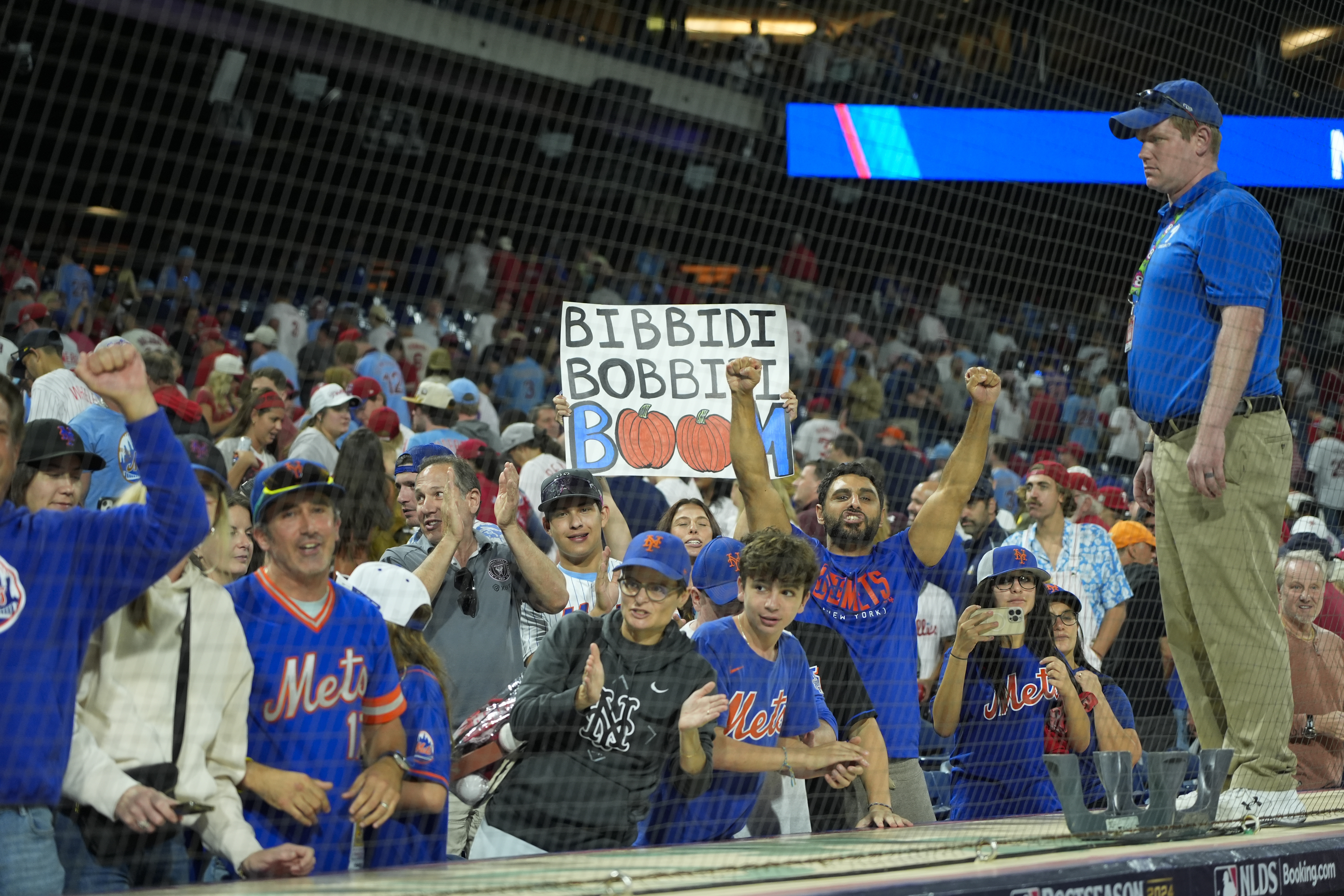 New York Mets fans celebrate after the Mets won Game 1 of a baseball NL Division Series against the Philadelphia Phillies, Saturday, Oct. 5, 2024, in Philadelphia. (AP Photo/Chris Szagola)