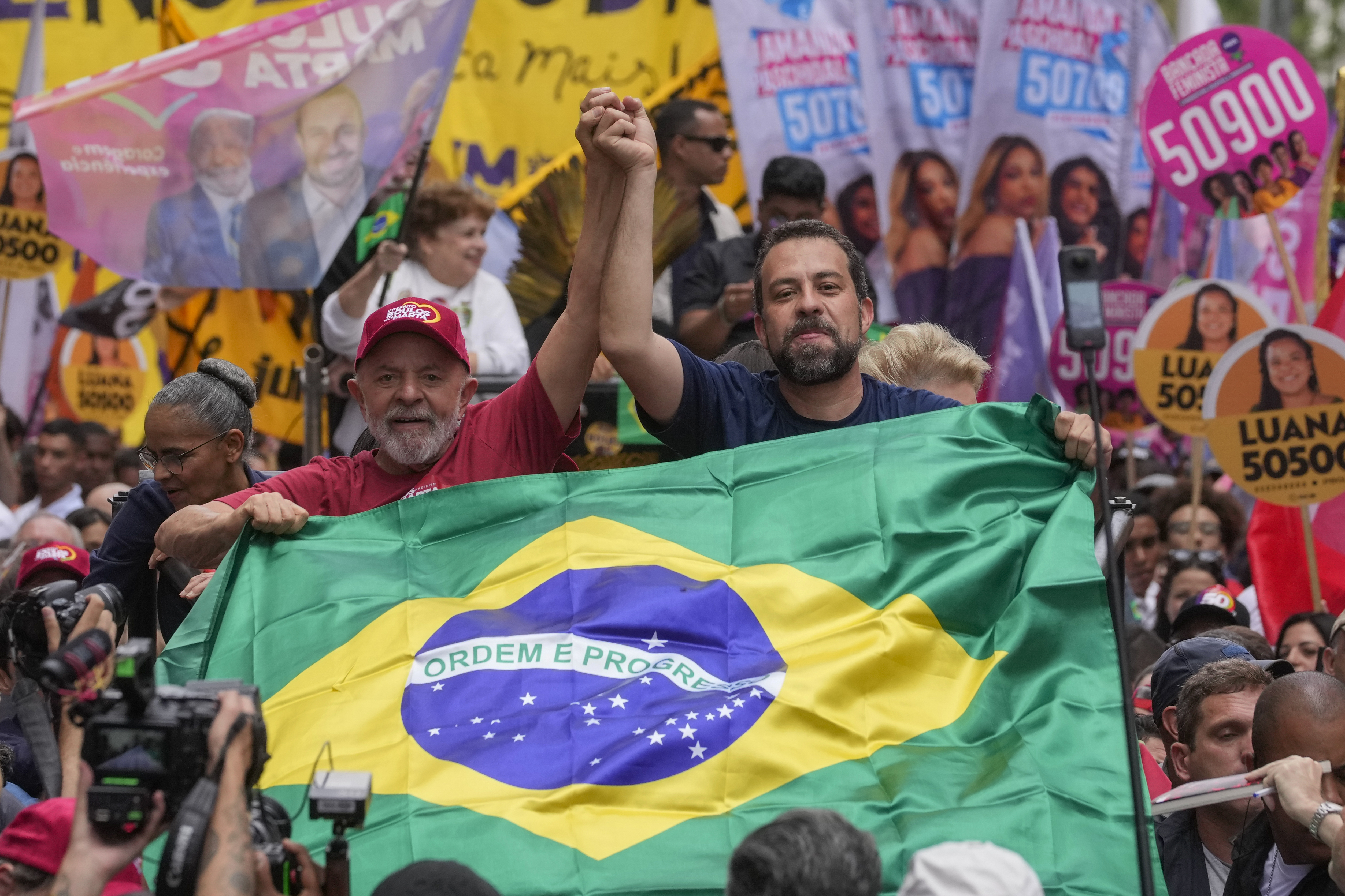 Brazilian President Luiz Inacio Lula da Silva, left, campaigns with mayoral candidate Guilherme Boulos of the Socialism and Liberty Party the day before elections in Sao Paulo, Saturday, Oct. 5, 2024. (AP Photo/Andre Penner)