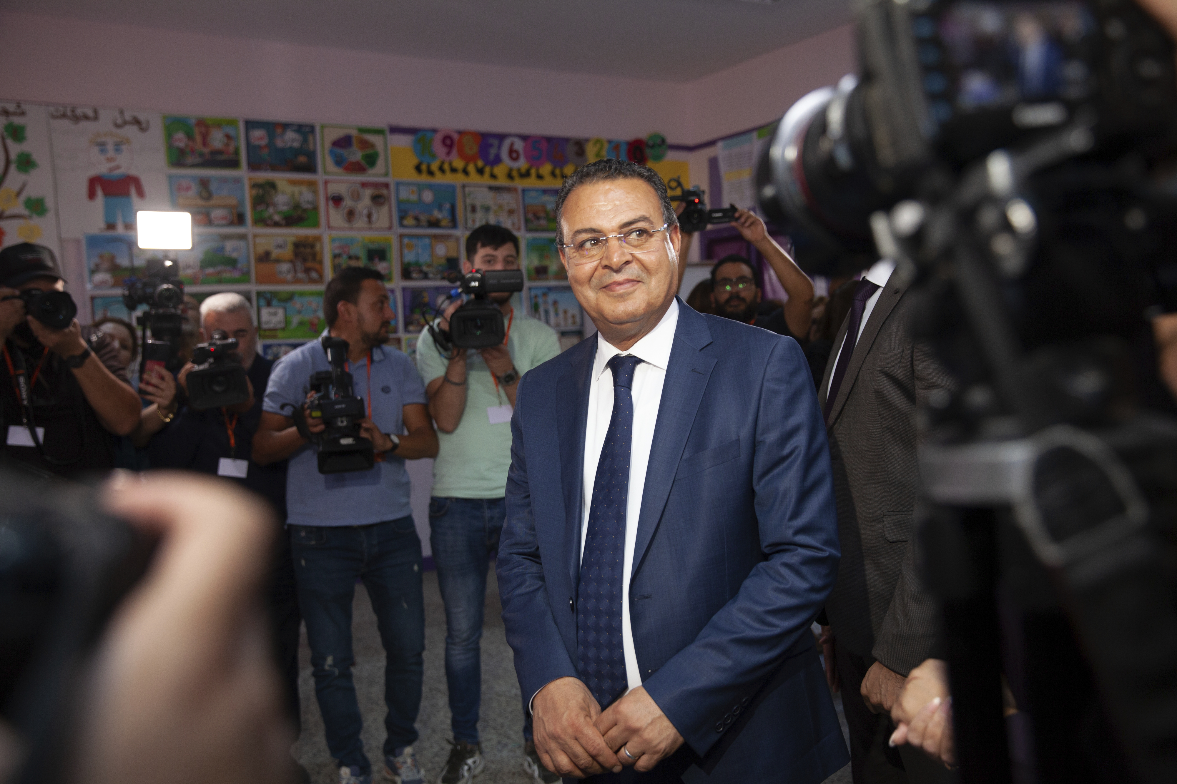 Tunisian President Presidential candidate Zouhair Maghzaoui prepares to cast his vote at a polling station during the presidential elections, in the capital Tunis, Tunisia, Sunday, Oct. 6, 2024. (AP Photo/Ons Abid)