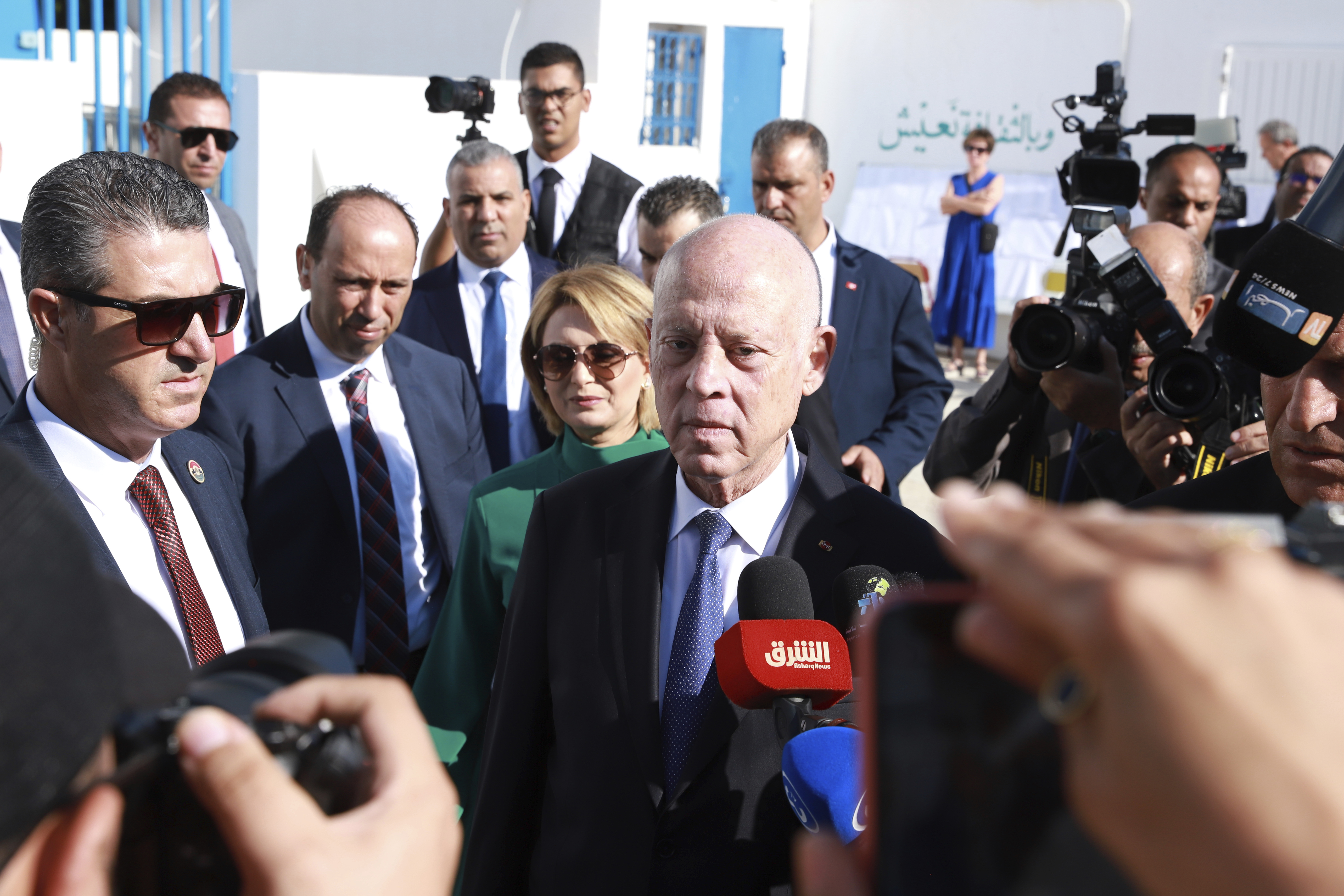 Tunisian President and candidate for re-election Kais Saied, center, and his wife Ichraf Chebil Saïed, leave a polling station after casting their votes, in Tunis, Tunisia, Sunday, Oct. 6, 2024 (AP Photo/Anis Mili)