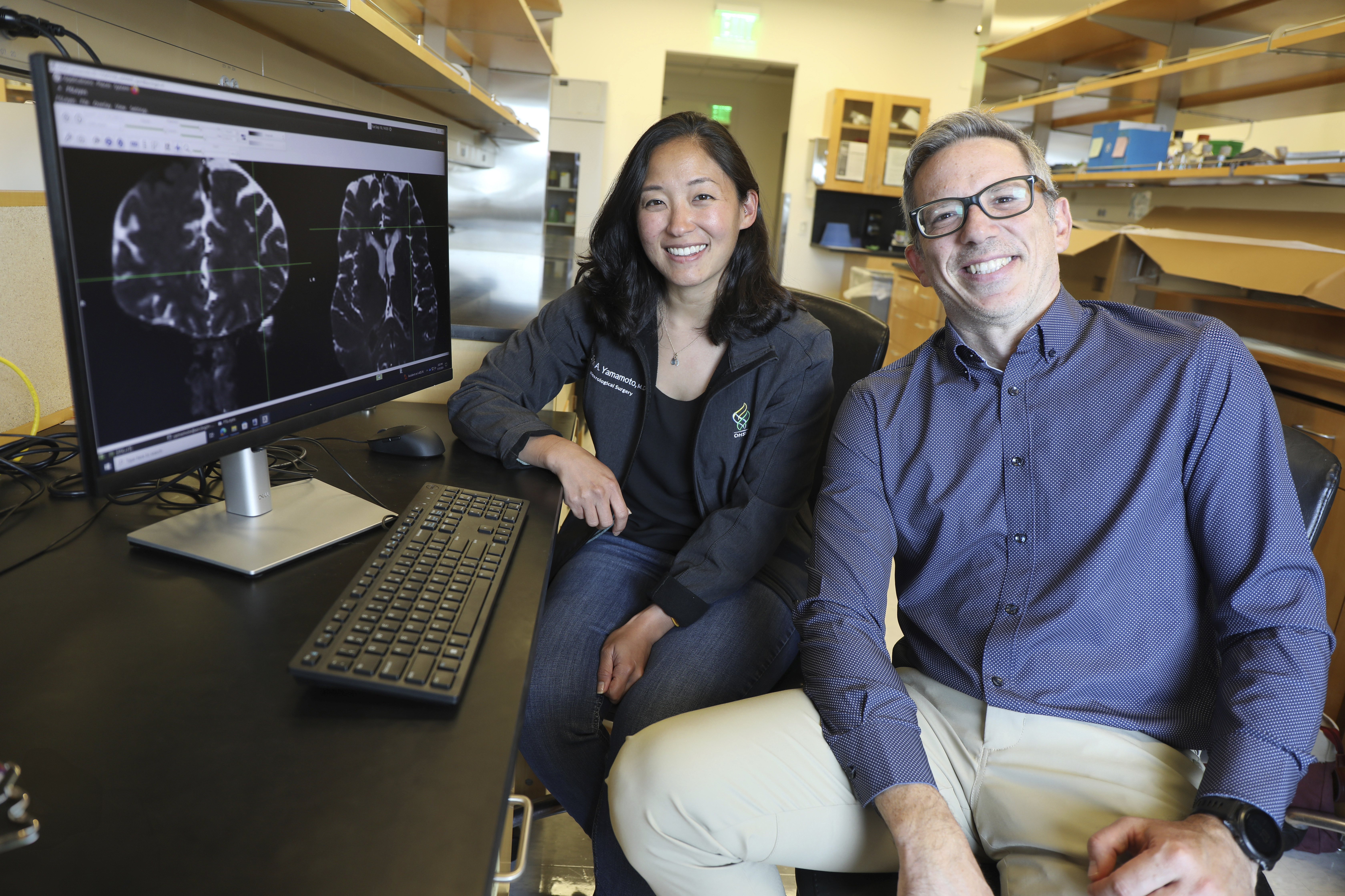 This undated photo provided by the Oregon Health & Science University in October 2024 shows Drs. Erin Yamamoto, left, and Juan Piantino, who used special imaging to spot a long-suspected pathway the human brain uses to clear waste. (Christine Torres Hicks/OHSU via AP)