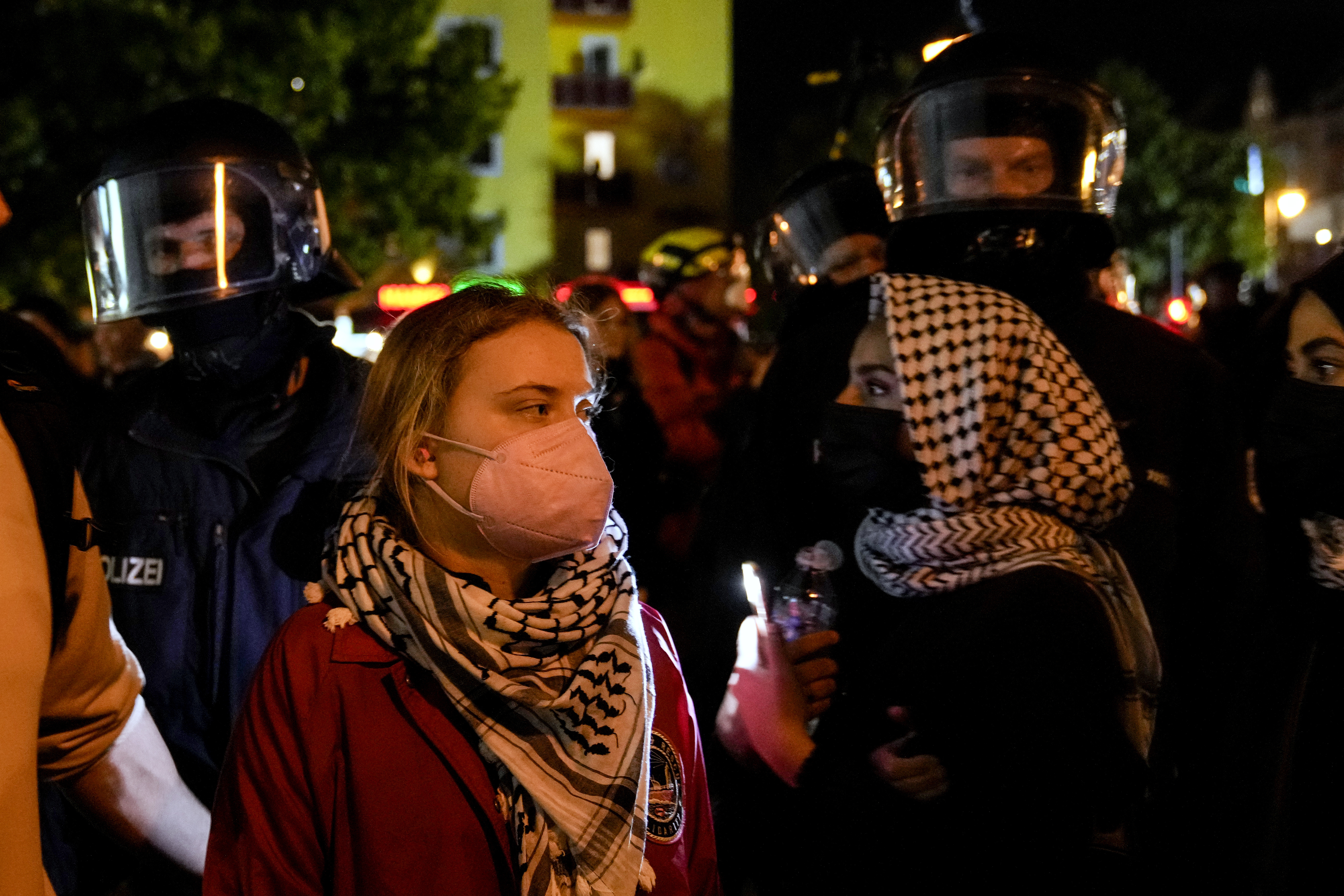 Activist Greta Thunberg, left, attends a pro-Palestinian rally in Berlin, Monday, Oct. 7, 2024. (AP Photo/Ebrahim Noroozi)