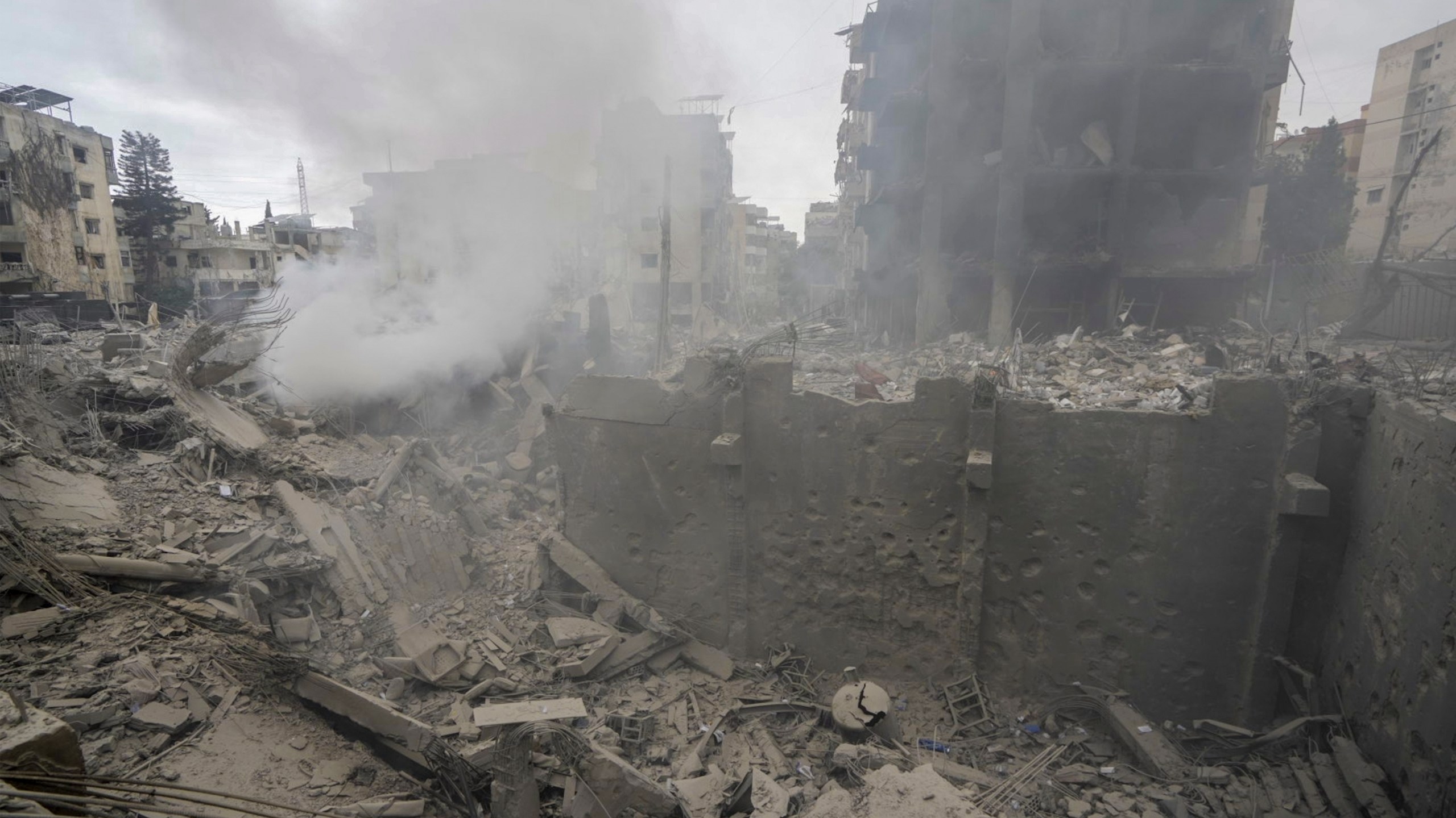 Smoke rises from destroyed buildings at the site of an Israeli airstrike hit in Choueifat, southeast of Beirut, Lebanon, Monday, Oct. 7, 2024. (AP Photo/Bilal Hussein)