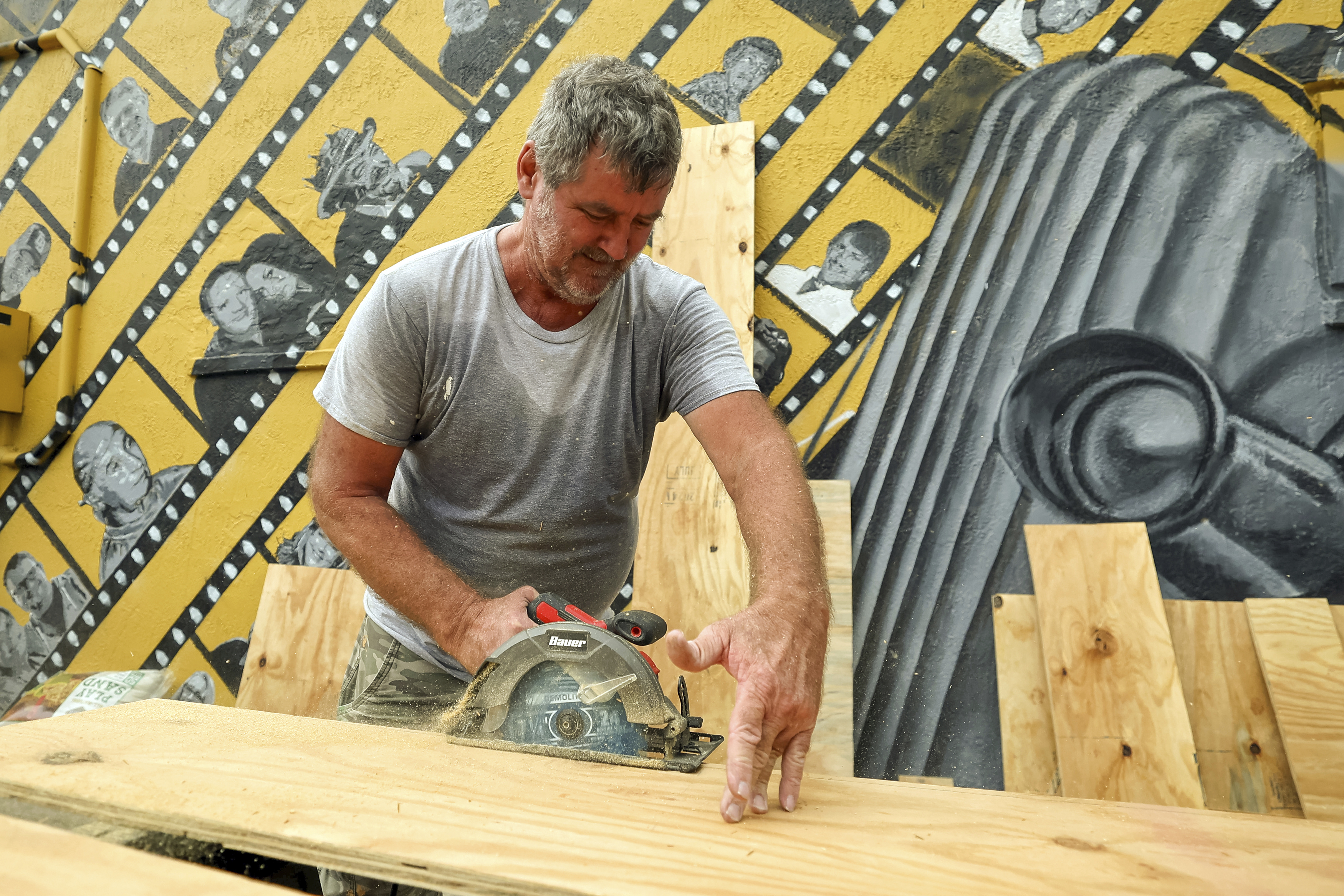 Jay McCoy puts up plywood in preparation for Hurricane Milton on Monday, Oct. 7, 2024, in New Port Richey, Fla. (AP Photo/Mike Carlson)