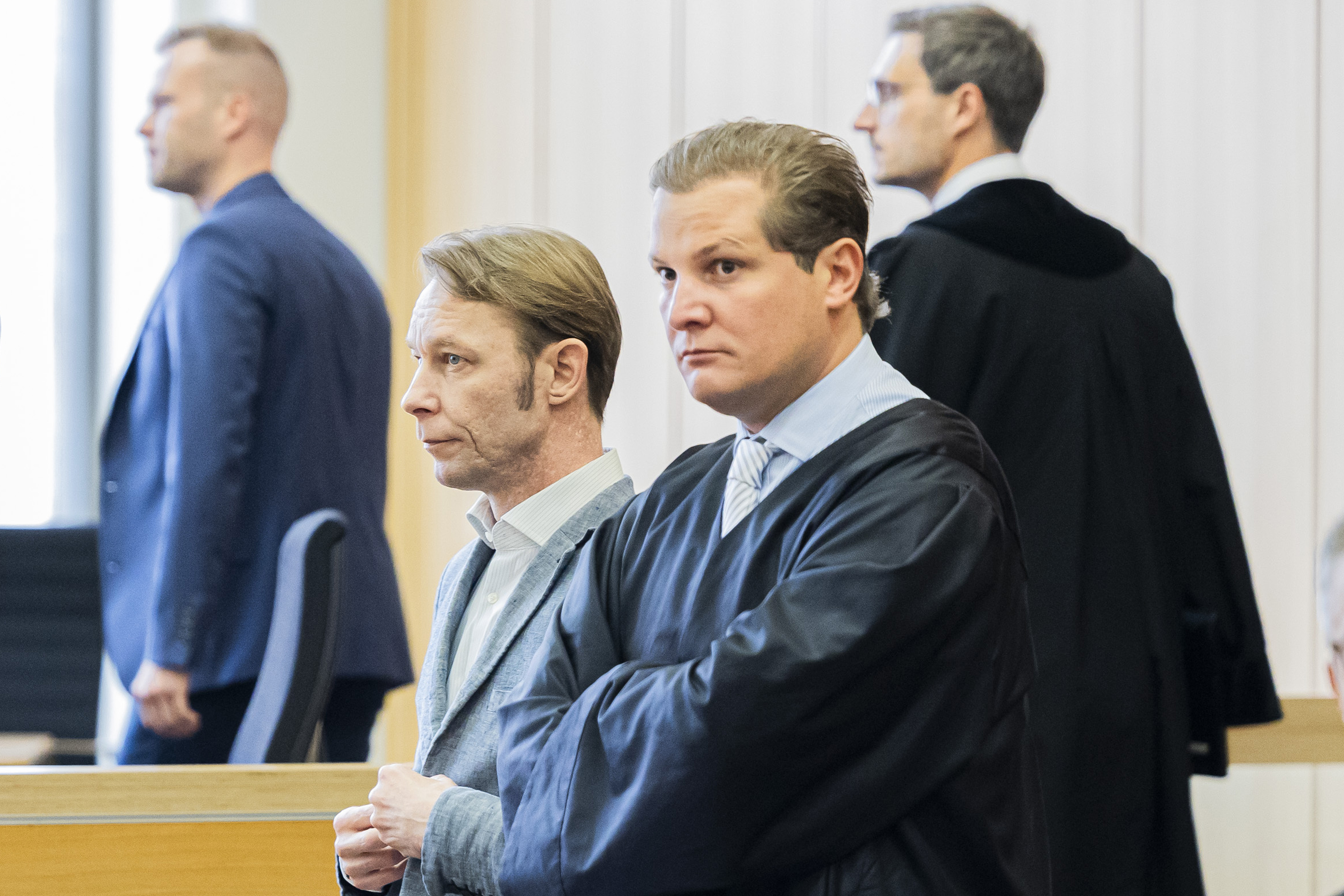 Christian Brueckner, center, stands in the courtroom at Braunschweig District Court before the start of the trial, in Brunswick, Germany, Tuesday Oct. 8, 2024. (Michael Matthey/dpa via AP)