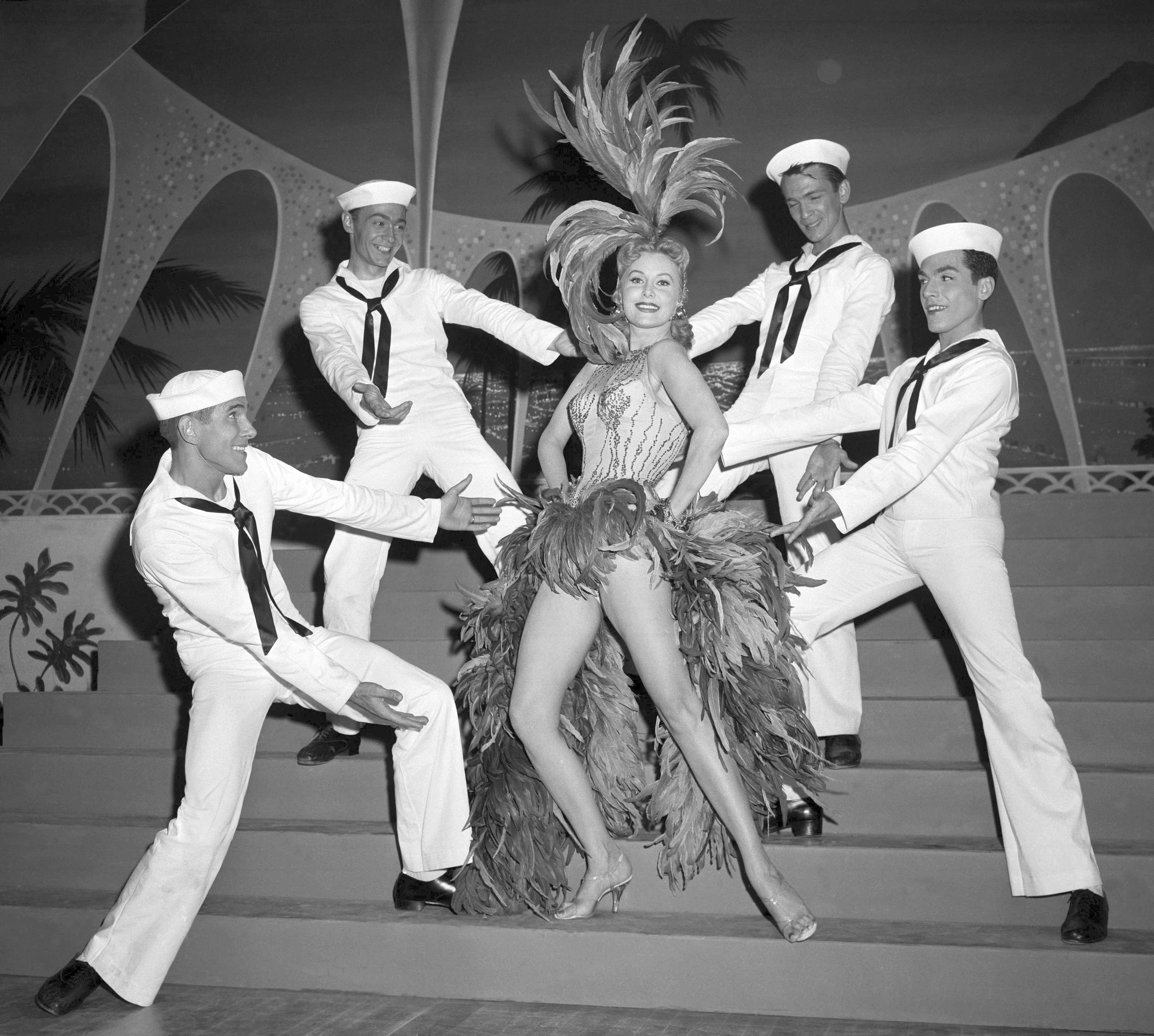 FILE - Actress Rhonda Fleming blossoms out as a singer and dancer in the first night club appearance of her career at the New Tropicana hotel, on May 20, 1957, in Las Vegas. (AP Photo/David Smith, File)