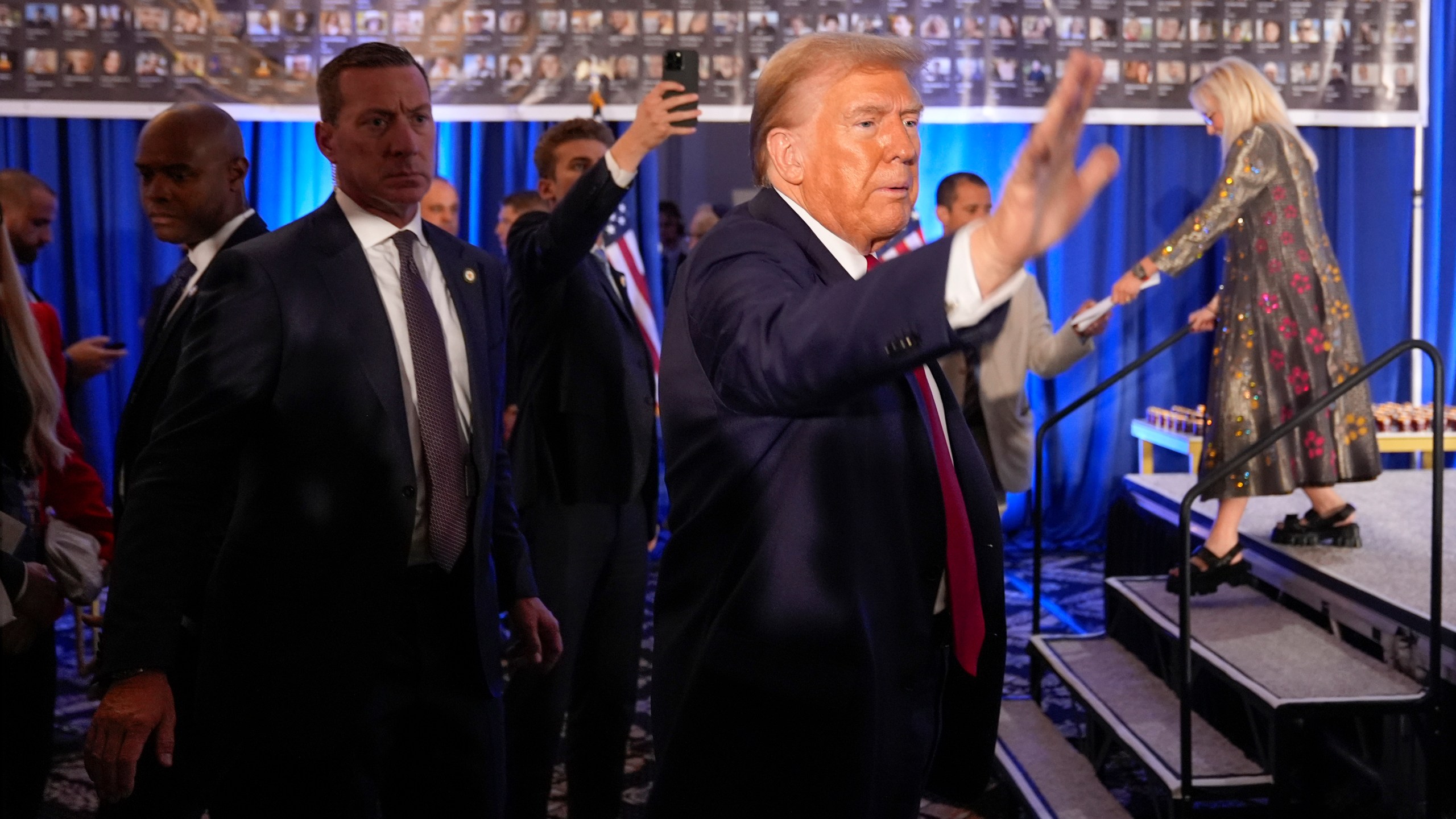 Republican presidential nominee former President Donald Trump waves as he departs an event marking one year since the Oct. 7 Hamas attack on Israel, Monday, Oct. 7, 2024, in Miami. (AP Photo/Alex Brandon)