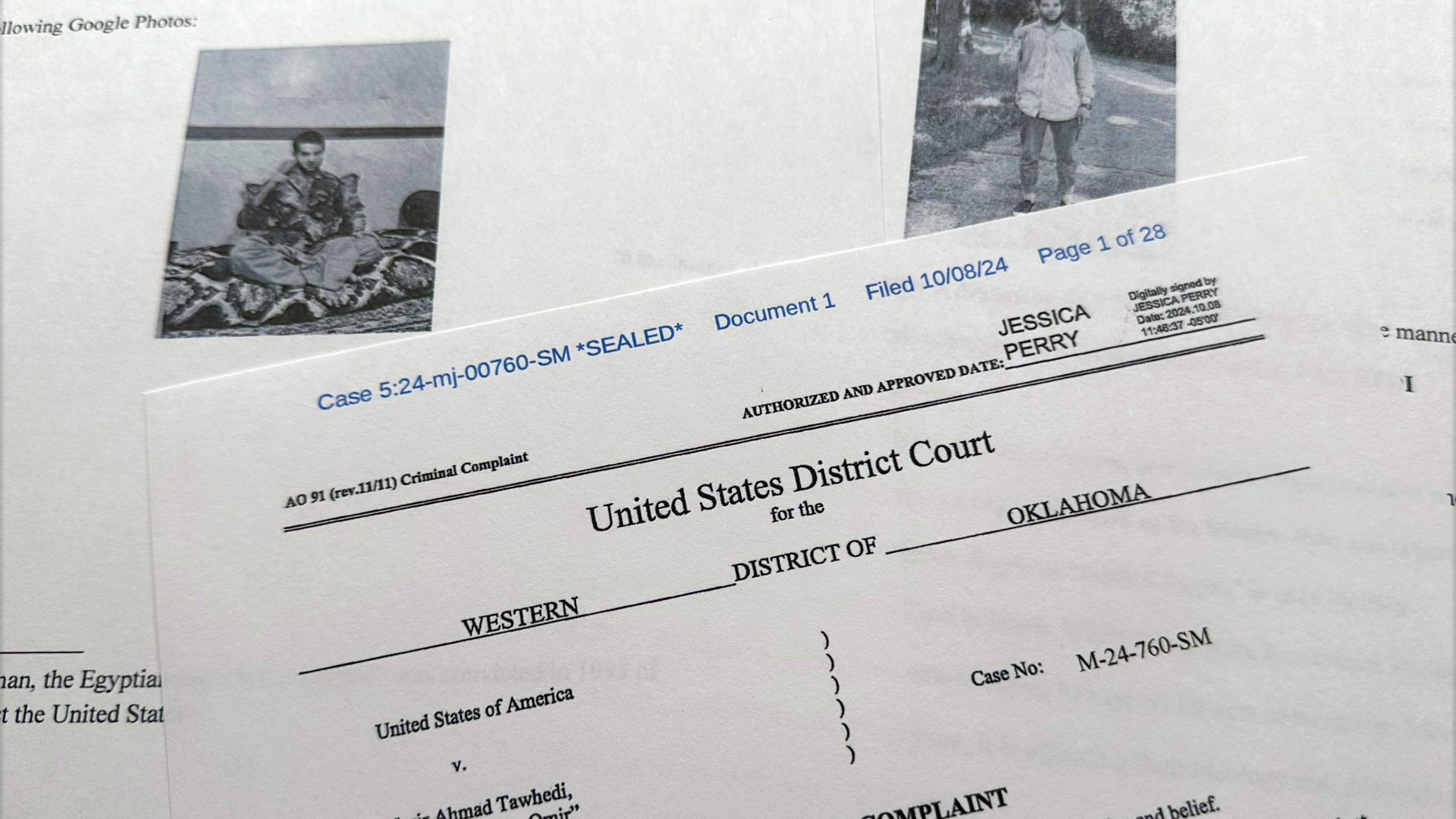 The criminal complaint, filed by the Justice Department, against Nasir Ahmad Tawhedi, 27,of Oklahoma City is photographed Tuesday, Oct. 8, after the FBI arrested the man who officials say was inspired by the Islamic State militant organization and was plotting an Election Day attack targeting large crowds in the U.S. (AP Photo/Jon Elswick)