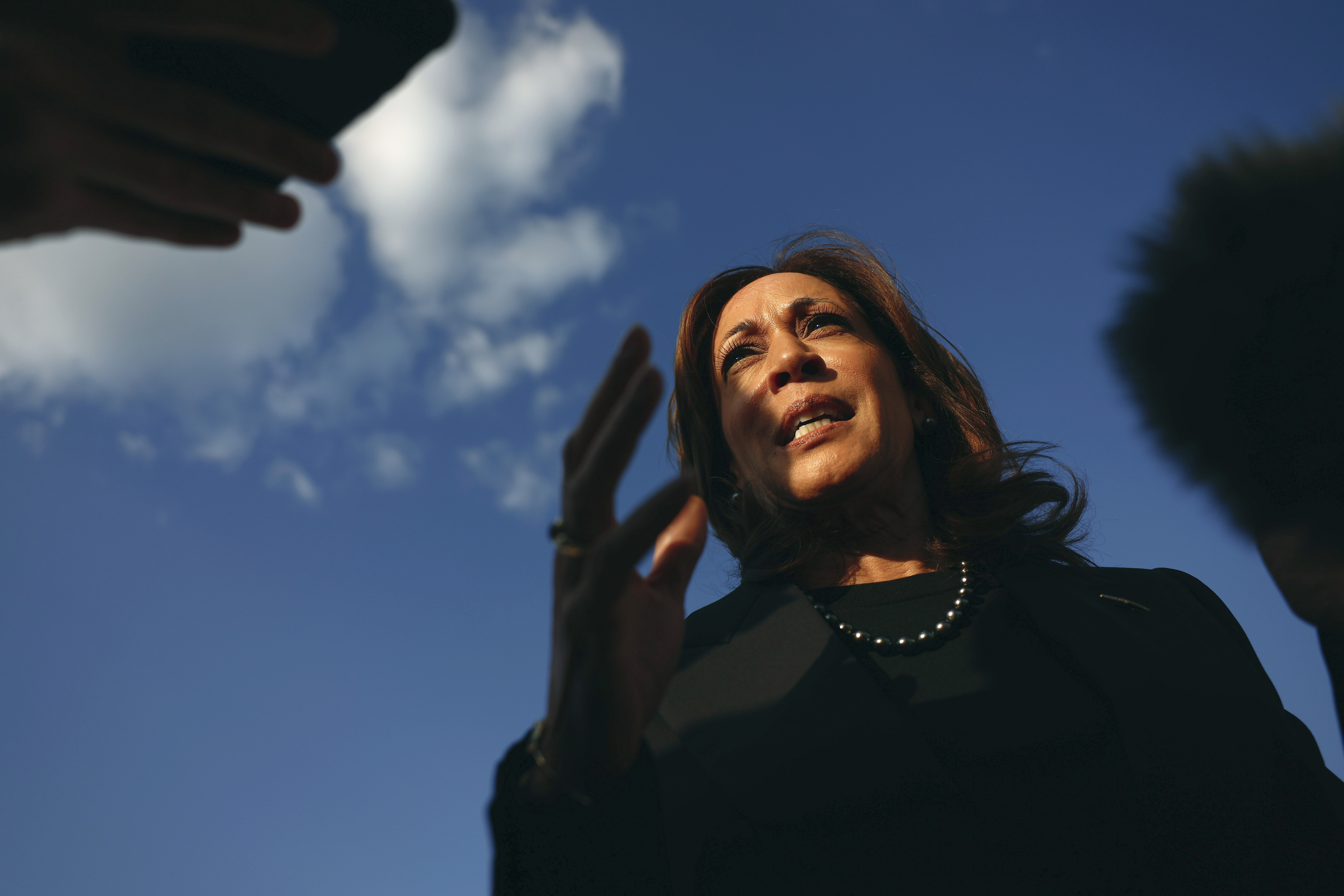 Democratic presidential nominee Vice President Kamala Harris speaks to reporters before boarding Air Force Two to depart for New York at Joint Base Andrews, Md., Monday, Oct. 7, 2024. (Evelyn Hockstein/Pool via AP)