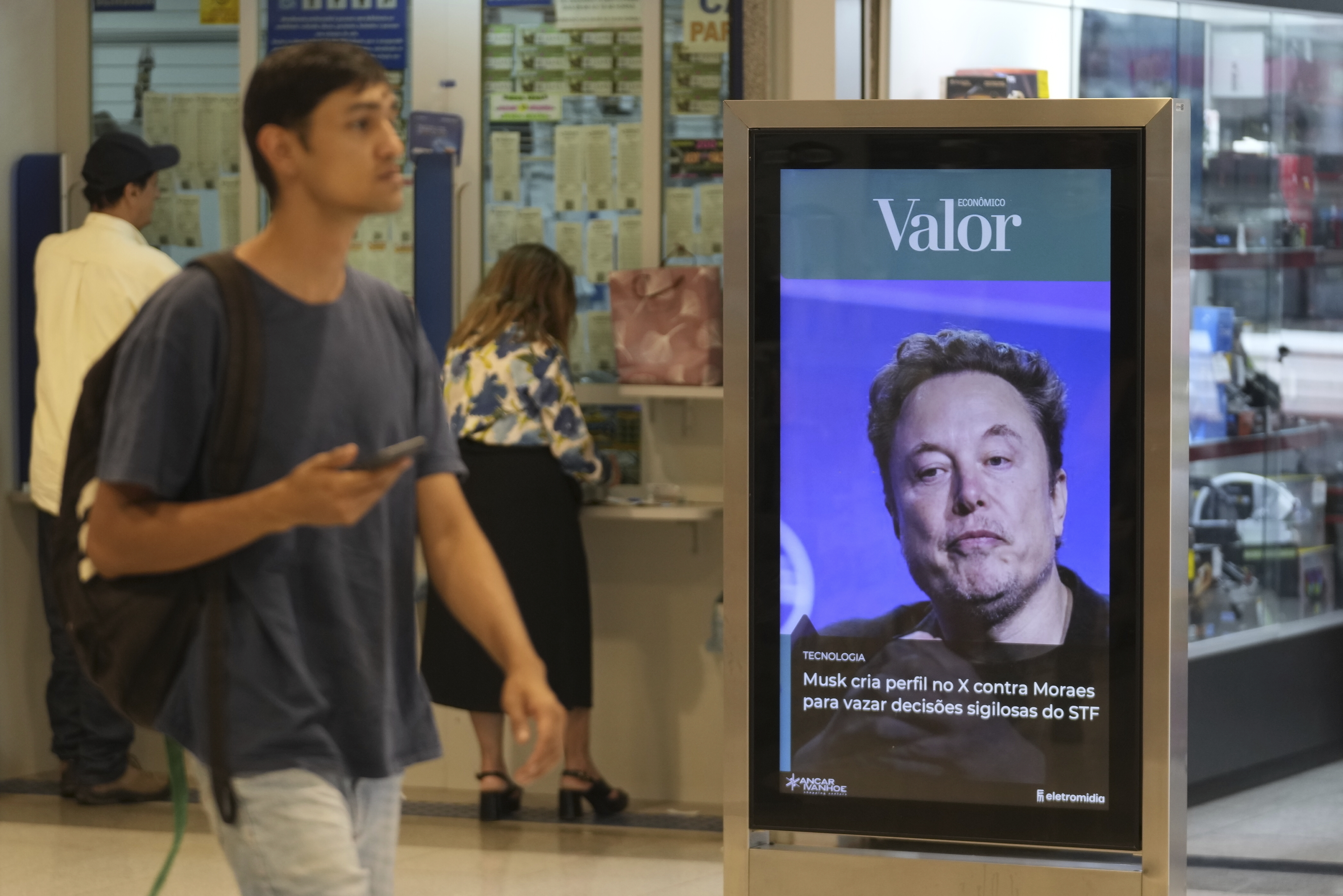 FILE - An ad by Valor media shows a photo of Elon Musk at a shopping center in Brasilia, Brazil, Monday, Sept. 2, 2024. (AP Photo/Eraldo Peres, File)