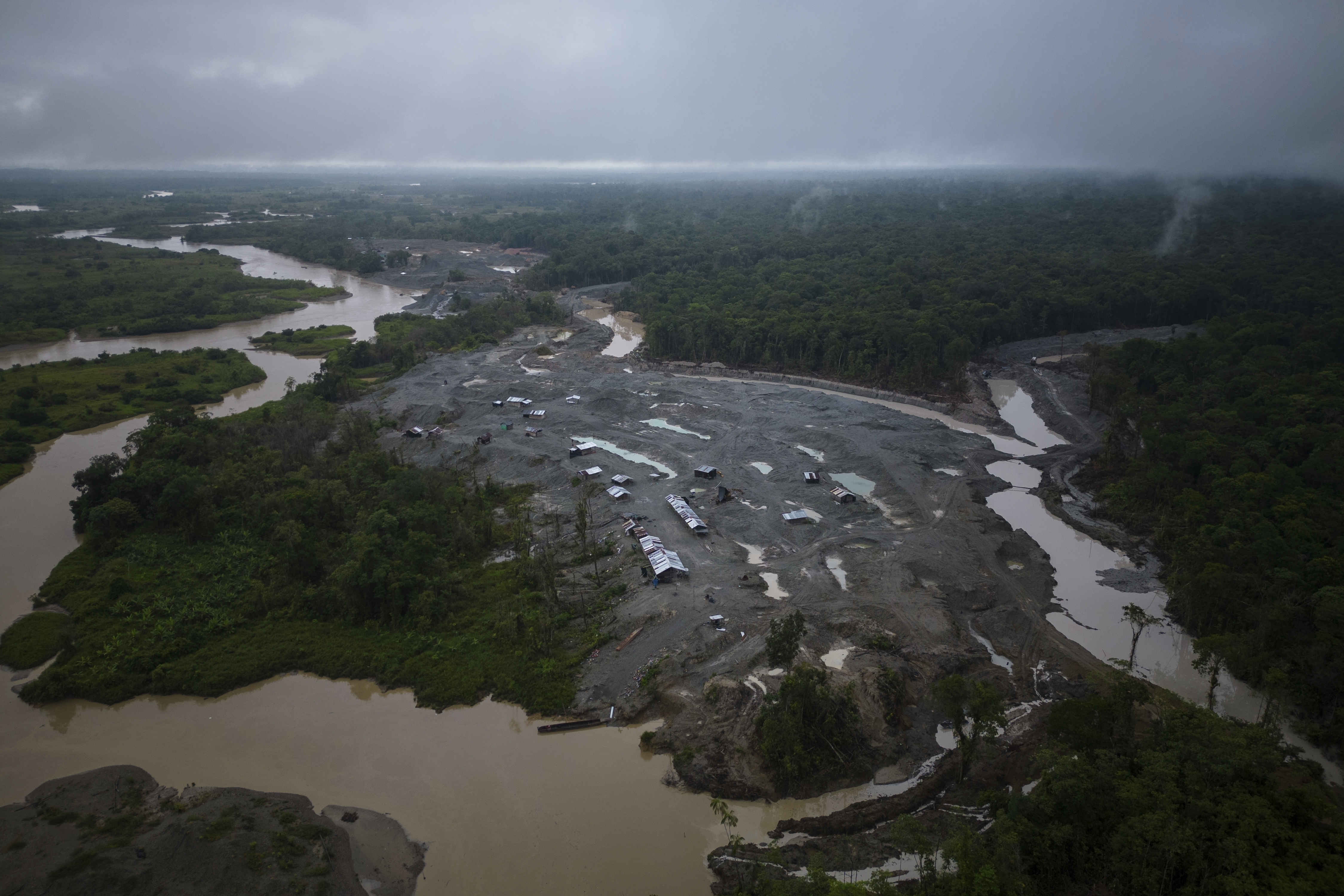 An illegal mining camp, sits along the Quito River, near Paimado, Colombia, Monday, Sept. 23, 2024. (AP Photo/Ivan Valencia)