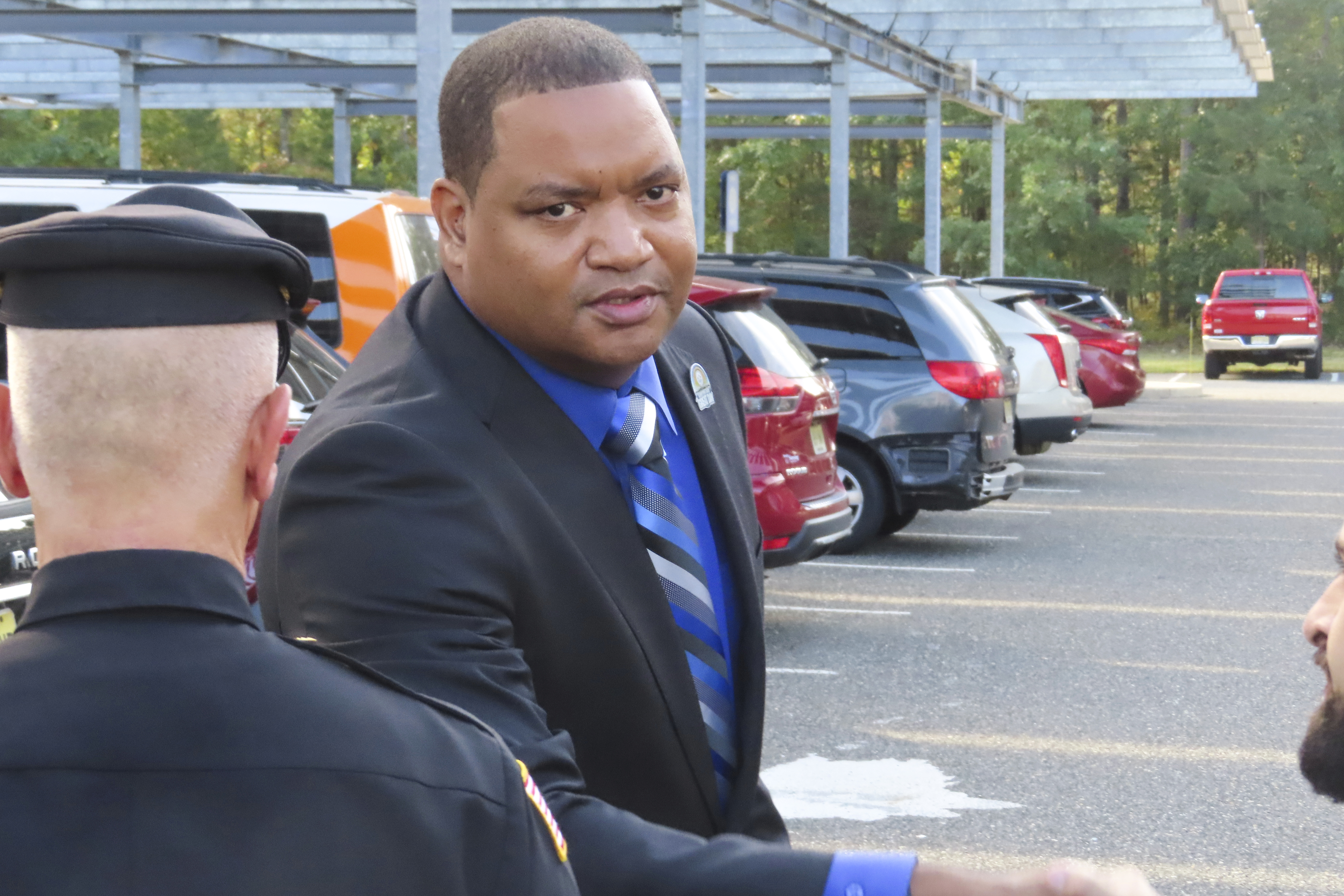 Atlantic City Mayor Marty Small Sr. shakes the hand of one of his lawyers after a court appearance on charges he and his wife La'Quetta Small, the city's superintendent of schools, beat and abused their teenage daughter, in Mays Landing, N.J., Thursday, Oct. 10, 2024. (AP Photo/Wayne Parry)