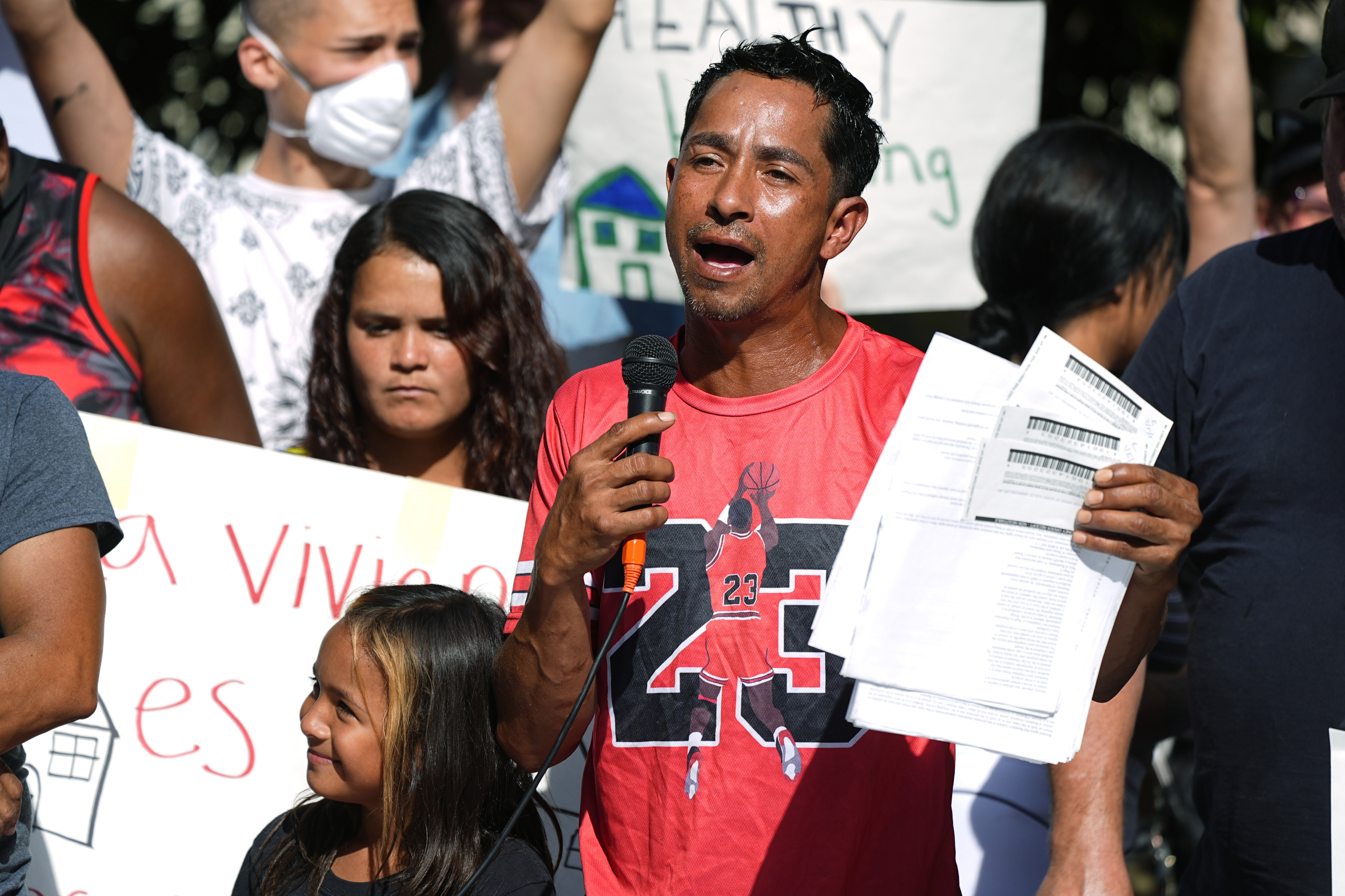 FILE - Juan Carlos Jimenez speaks during a rally by the East Colfax Community Collective to address chronic problems in the apartment buildings occupied by people displaced from their home countries in central and South America Sept. 3, 2024, in Aurora, Colo. (AP Photo/David Zalubowski, File)