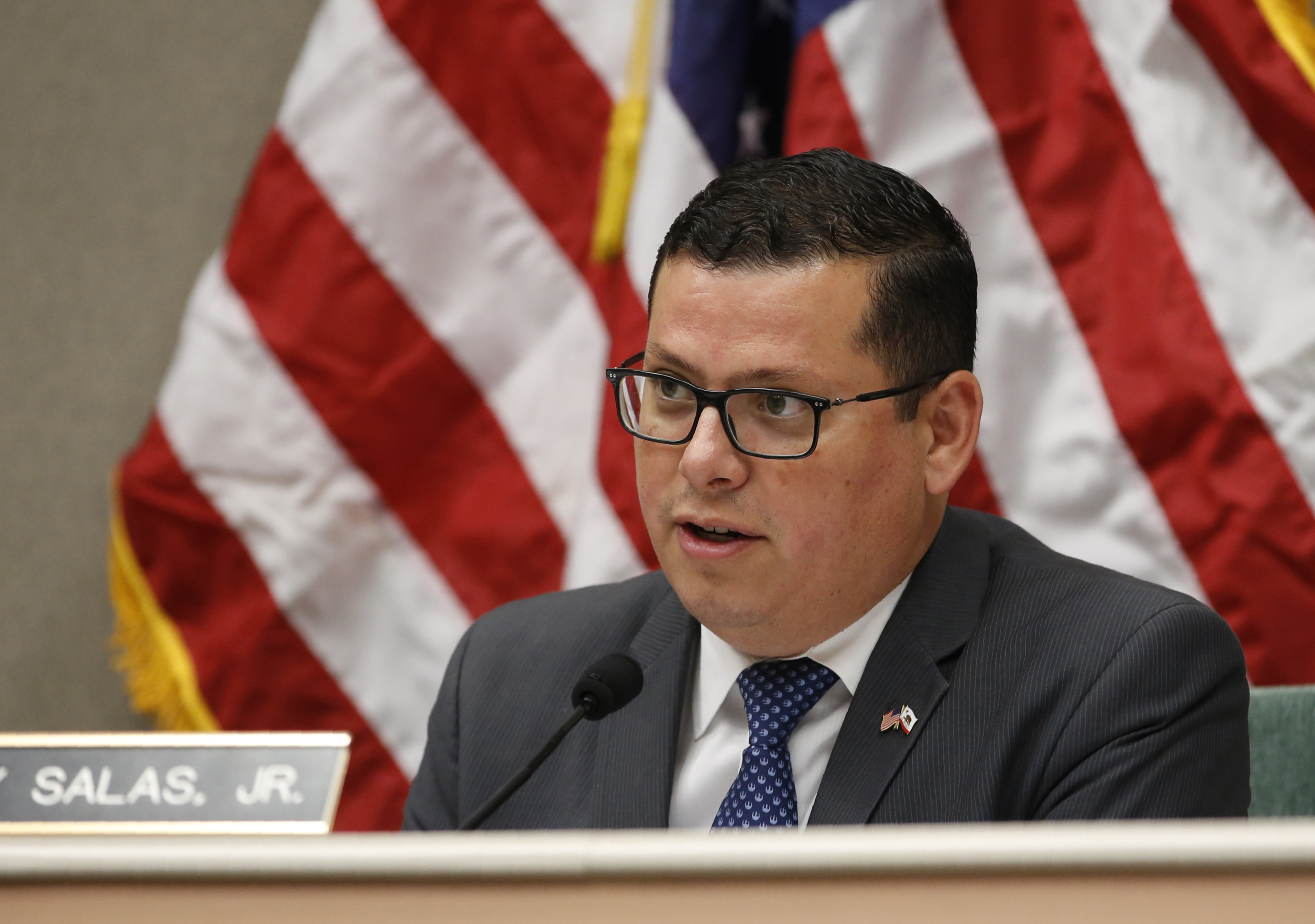 FILE - Assemblyman Rudy Salas Jr., asks questions during a hearing in Sacramento, Calif., Aug. 12, 2019. (AP Photo/Rich Pedroncelli, File)