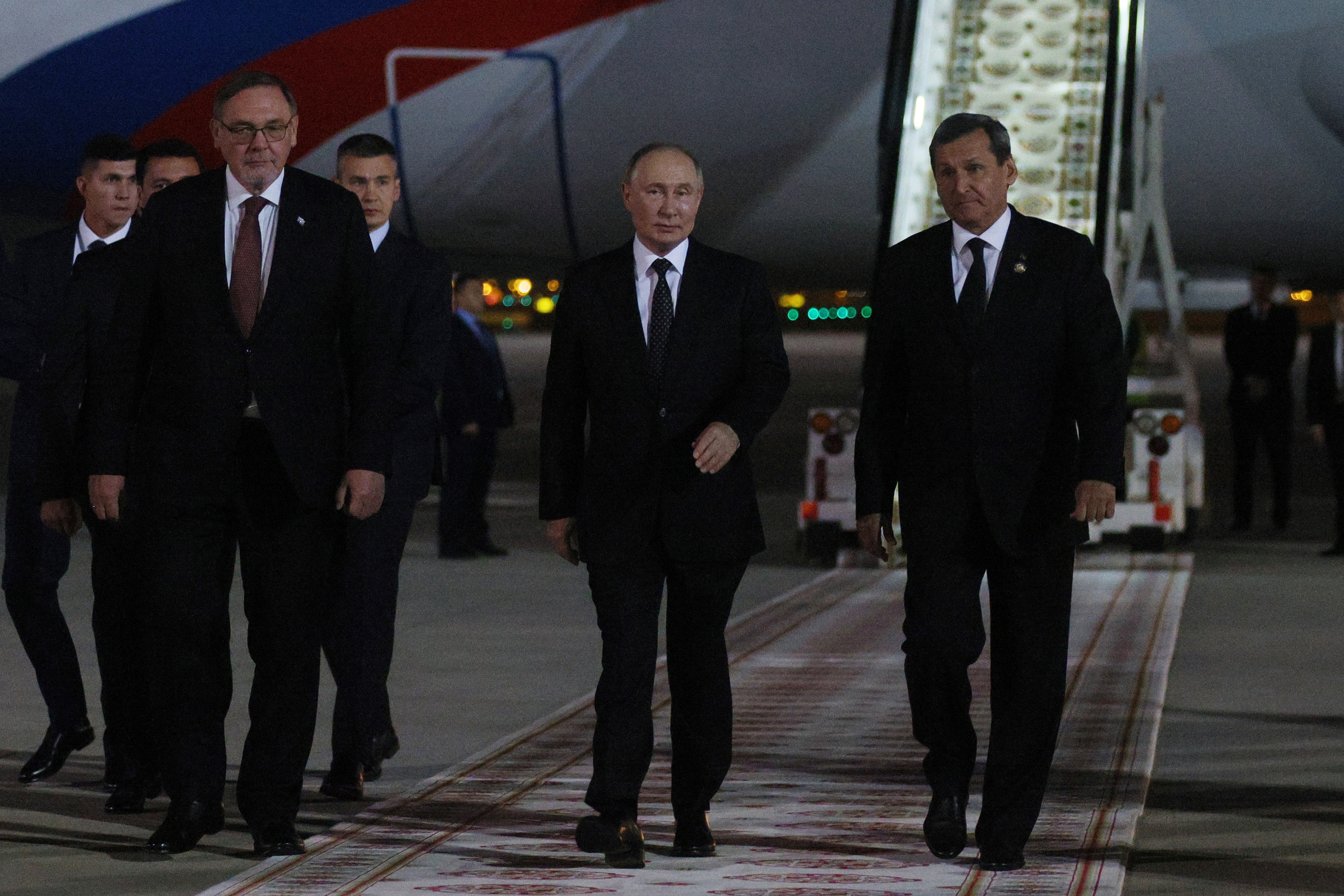 Russian President Vladimir Putin, 2nd right, is greeted by Turkmen Foreign Minister Rashid Meredov, right, upon his arrival in Ashgabat, Turkmenistan, Friday, Oct. 11, 2024. (Alexander Shcherbak, Sputnik, Kremlin Pool Photo via AP)